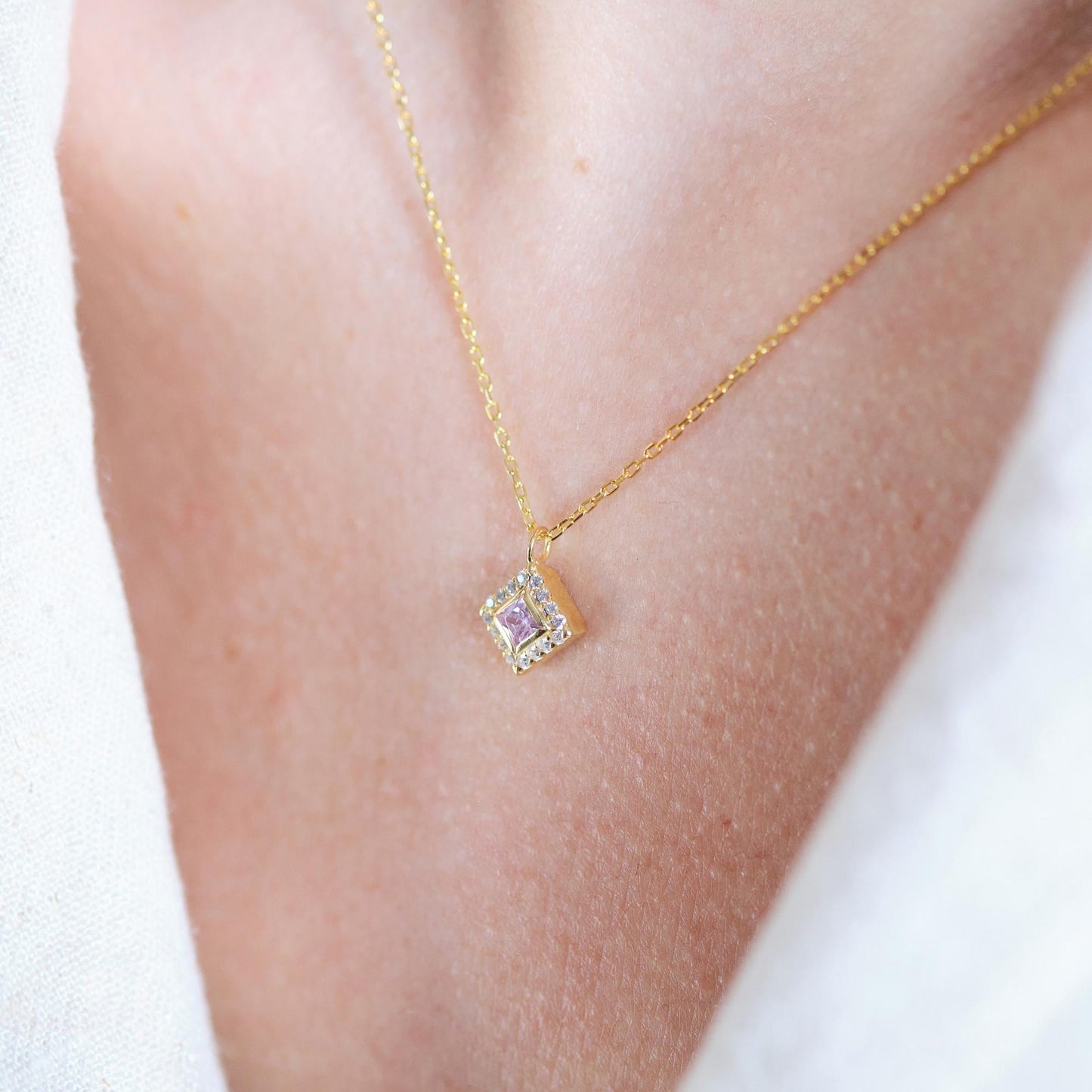 Add a bold touch with our square shaped necklaces adorned with sparkling stones along the edges and inside These stunning customizable pieces offer a blend of elegance and modern style perfect for enhancing your everyday look gifting someone special