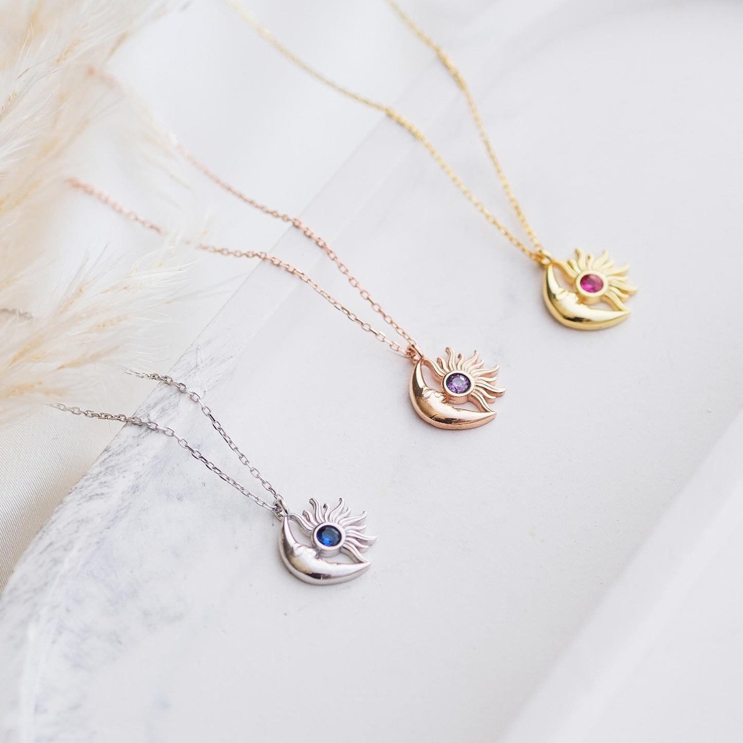 Shine bright with our Sun and Moon Necklace, featuring customizable gemstones. Choose stones that reflect your unique energy and style. This celestial-inspired piece, lets you create a truly personal and cosmic accessory