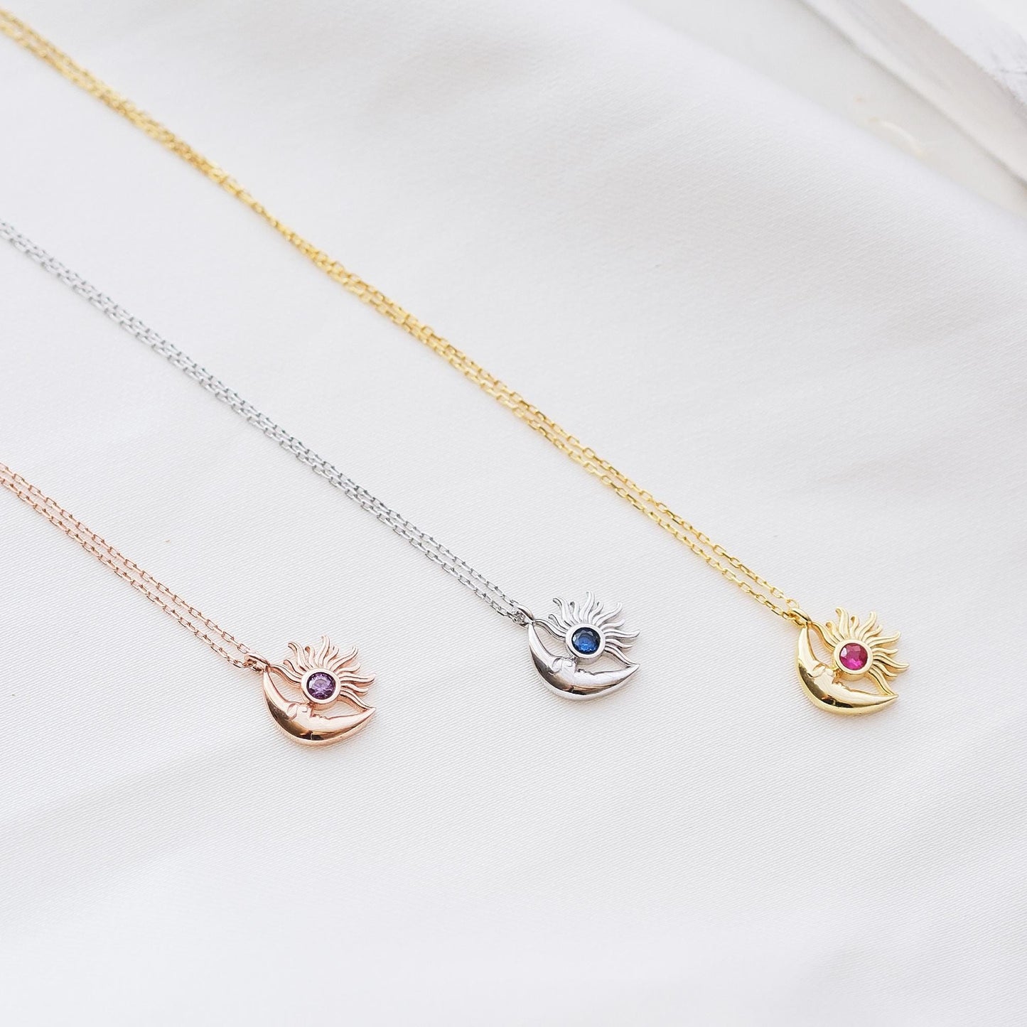 Shine bright with our Sun and Moon Necklace, featuring customizable gemstones. Choose stones that reflect your unique energy and style. This celestial-inspired piece, lets you create a truly personal and cosmic accessory