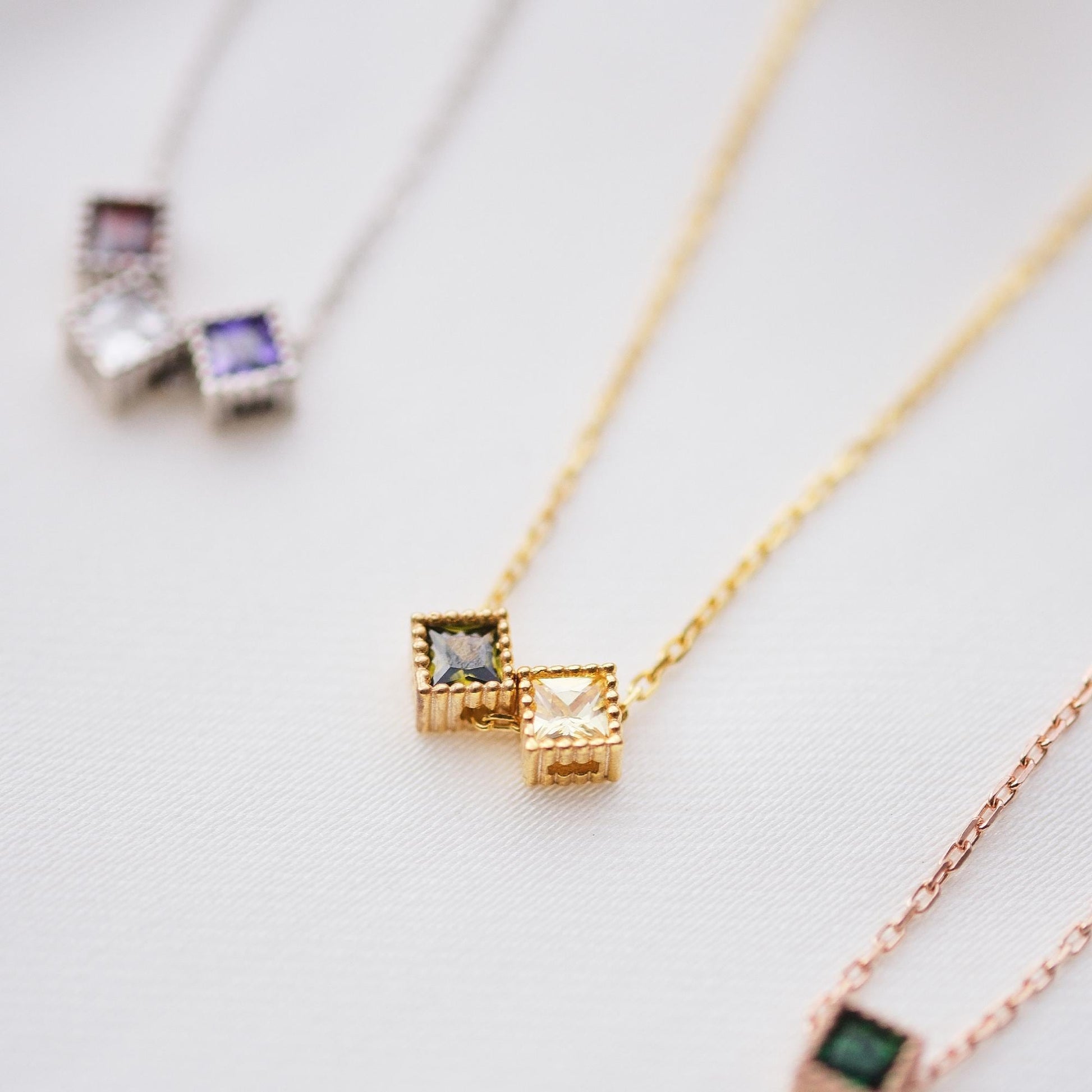 Dotted Elegance and Gemstone Sparkle: A Rose Gold, Gold, or Silver Necklace That Complements Every Look. Crafted with delicate dotted edges and a radiant gemstone centerpiece, this necklace brings a touch of luxury and versatility to any style.