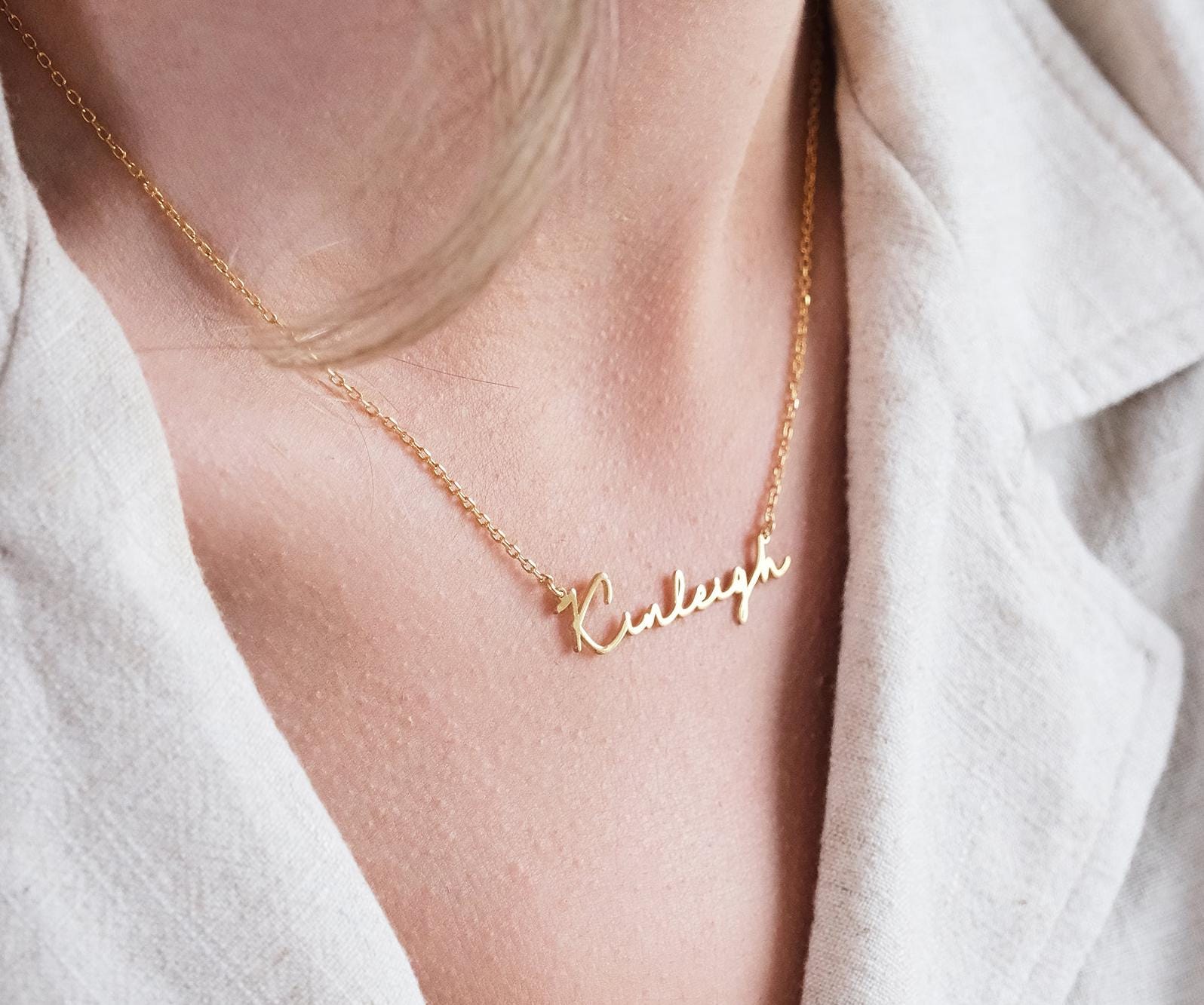 Present your loved ones with a unique gift through our customizable name necklaces. Available in gold, silver, and rose gold plating, these elegant and durable designs perfectly complement personal style. Add your name, and leave a lasting impression