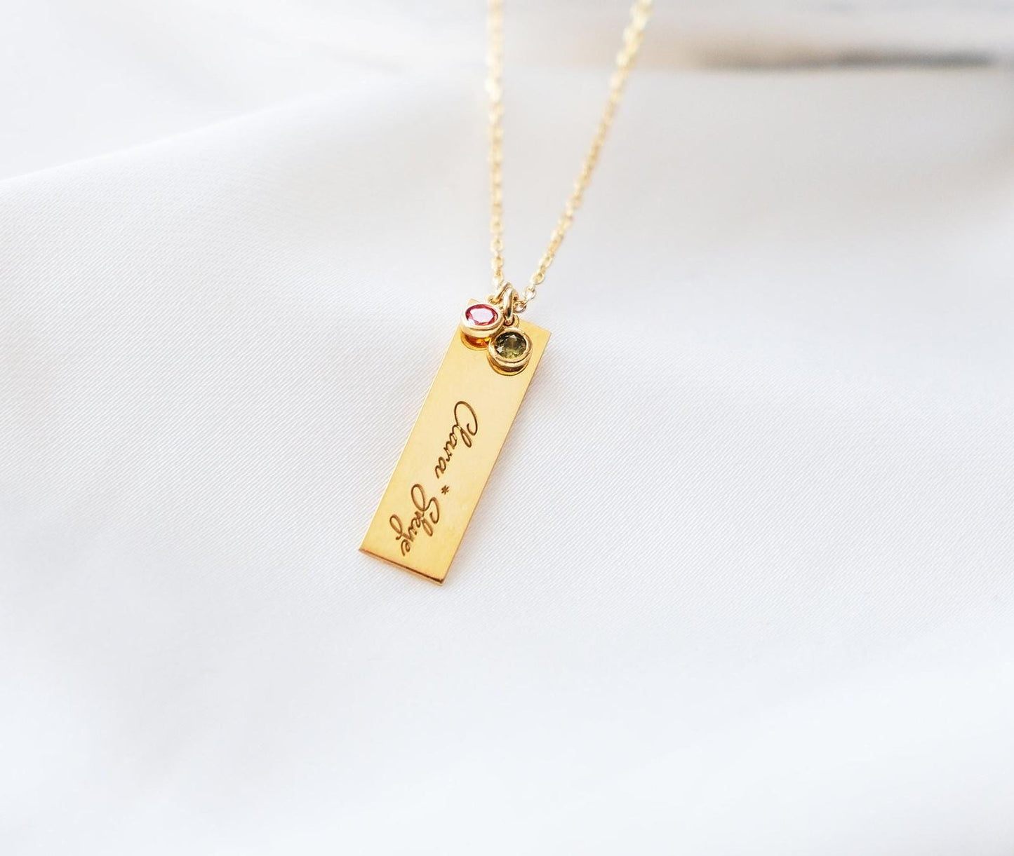 Our customizable bar necklaces with natural gemstones offer elegant personalization with name engraving. Available in gold, silver, and rose gold plating, these durable and stylish pieces perfectly enhance your personal style