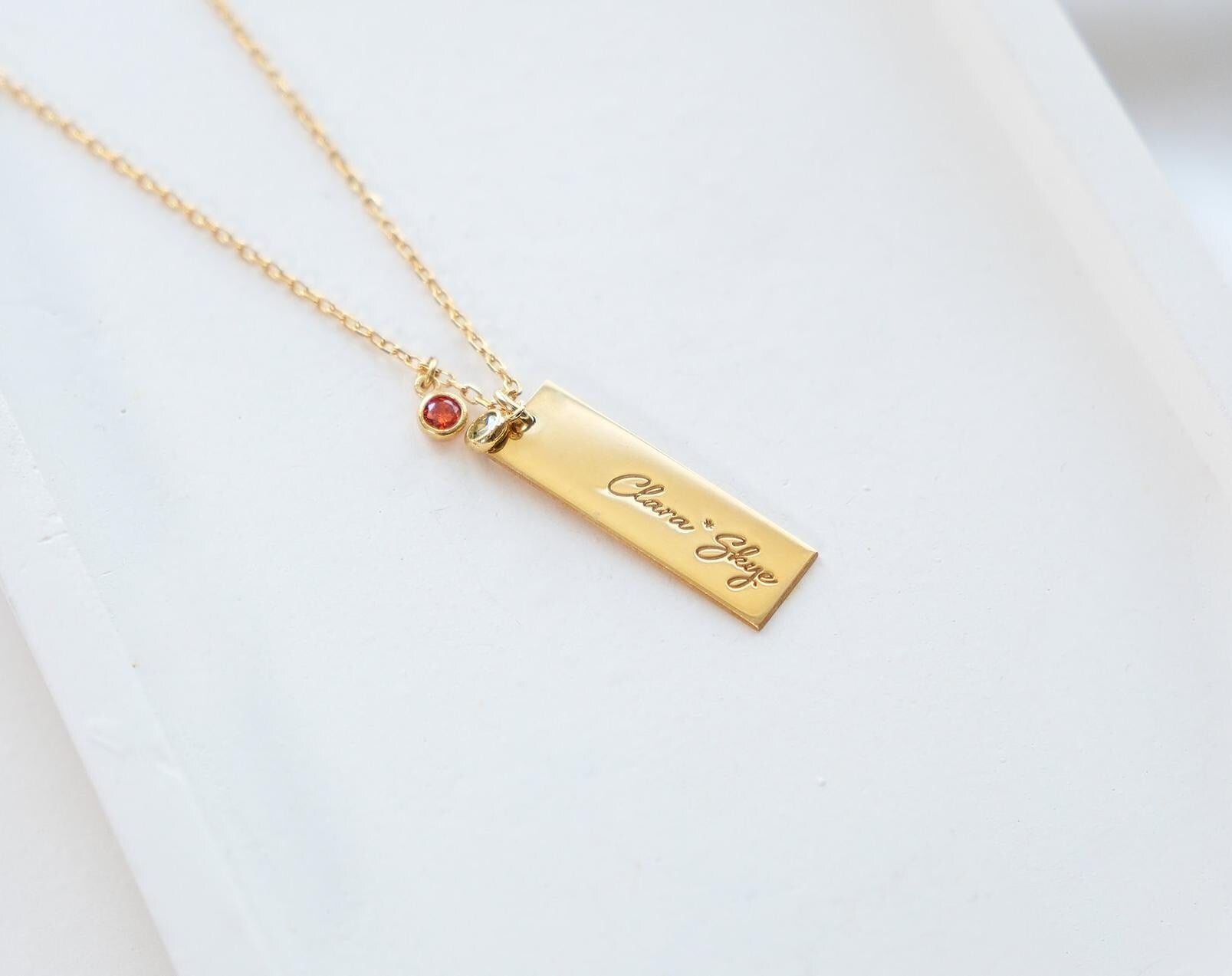 Our customizable bar necklaces with natural gemstones offer elegant personalization with name engraving. Available in gold, silver, and rose gold plating, these durable and stylish pieces perfectly enhance your personal style
