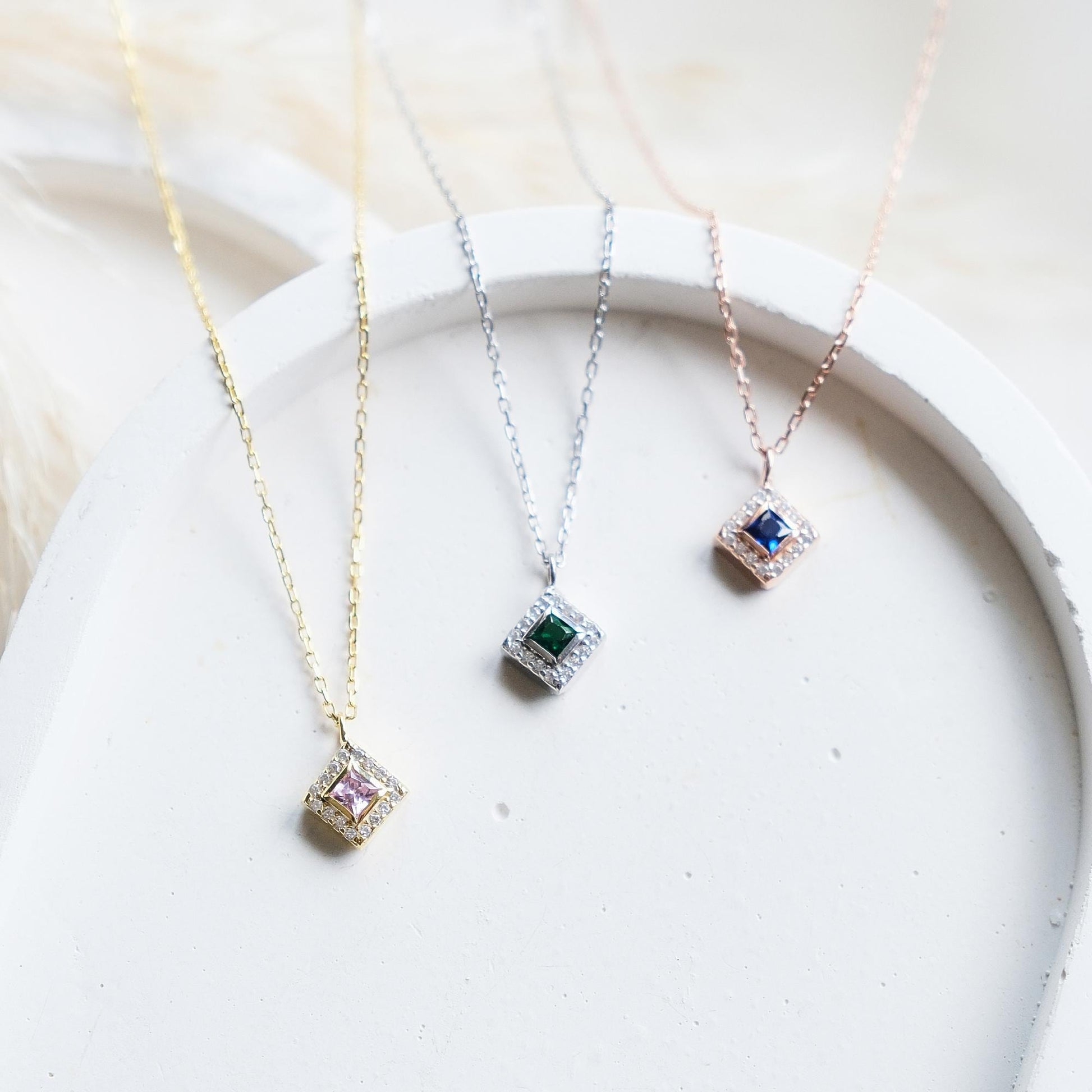 Add a bold touch with our square shaped necklaces adorned with sparkling stones along the edges and inside These stunning customizable pieces offer a blend of elegance and modern style perfect for enhancing your everyday look gifting someone special