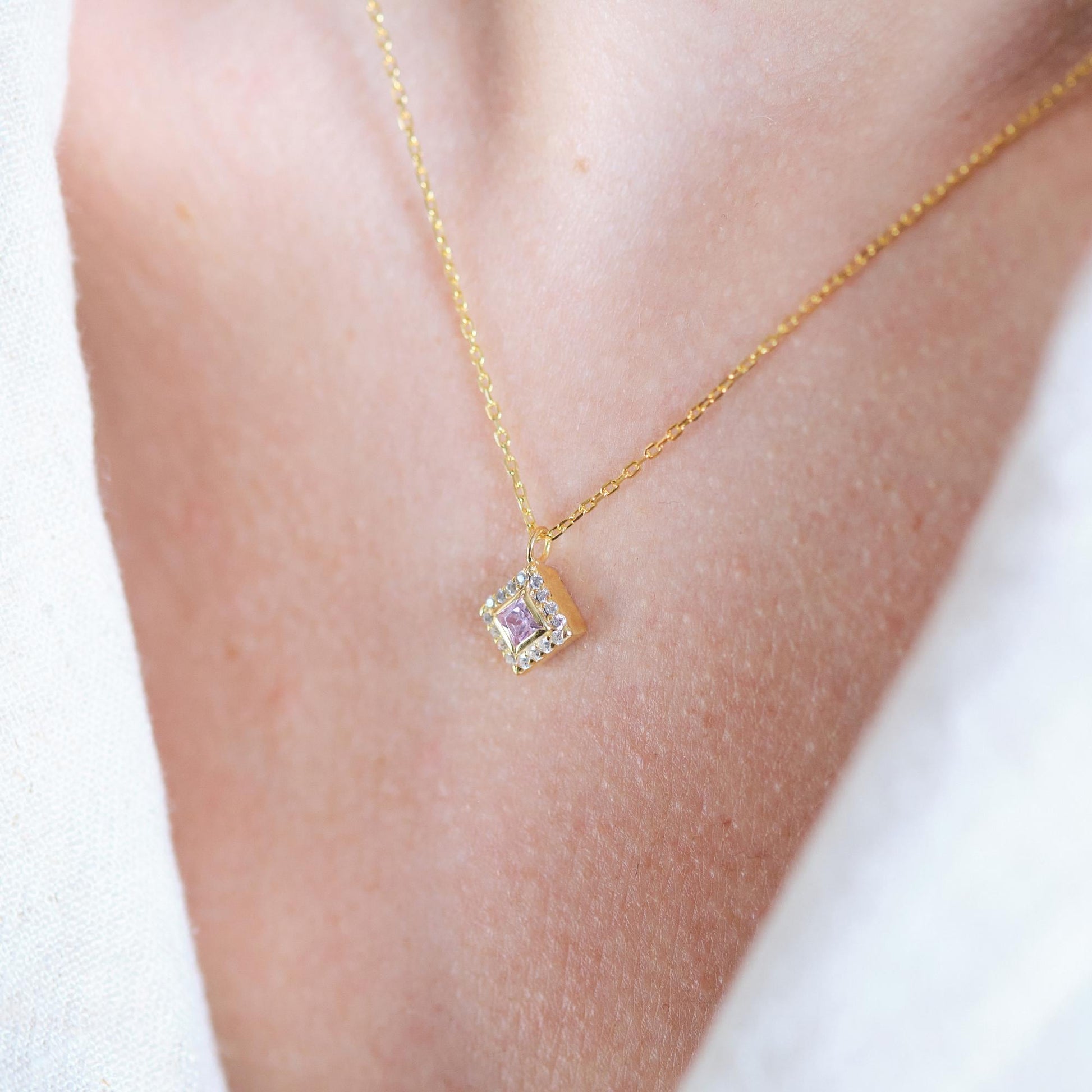 Add a bold touch with our square shaped necklaces adorned with sparkling stones along the edges and inside These stunning customizable pieces offer a blend of elegance and modern style perfect for enhancing your everyday look gifting someone special