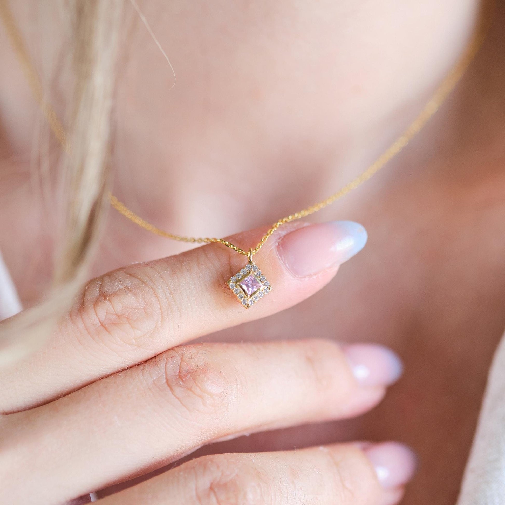 Add a bold touch with our square shaped necklaces adorned with sparkling stones along the edges and inside These stunning customizable pieces offer a blend of elegance and modern style perfect for enhancing your everyday look gifting someone special