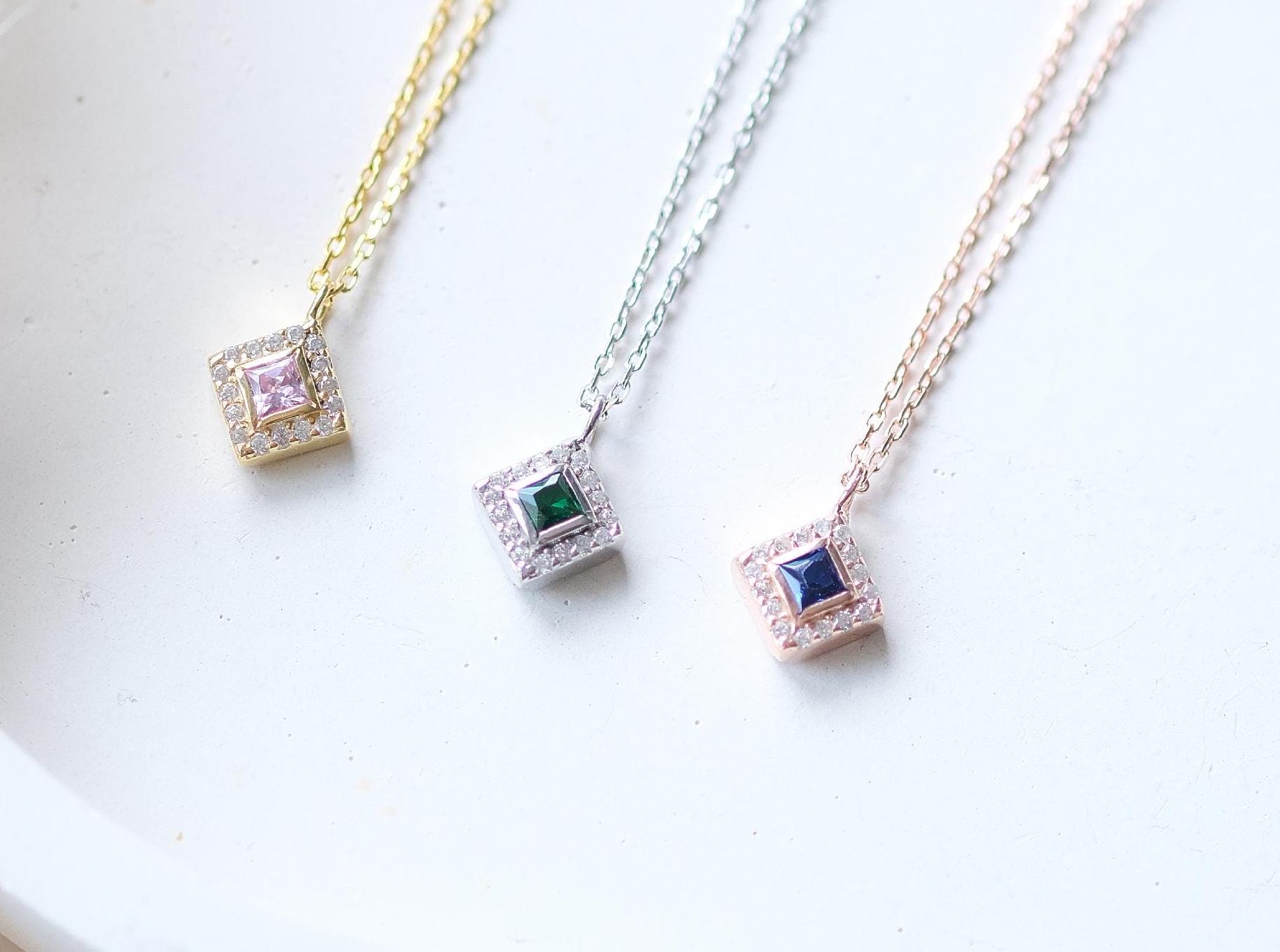 Add a bold touch with our square shaped necklaces adorned with sparkling stones along the edges and inside These stunning customizable pieces offer a blend of elegance and modern style perfect for enhancing your everyday look gifting someone special