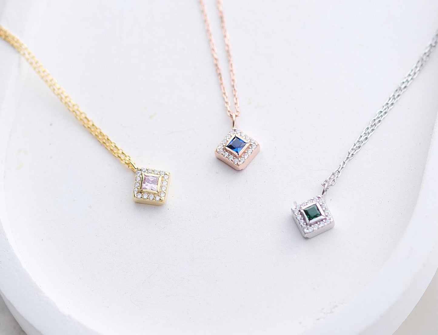 Add a bold touch with our square shaped necklaces adorned with sparkling stones along the edges and inside These stunning customizable pieces offer a blend of elegance and modern style perfect for enhancing your everyday look gifting someone special