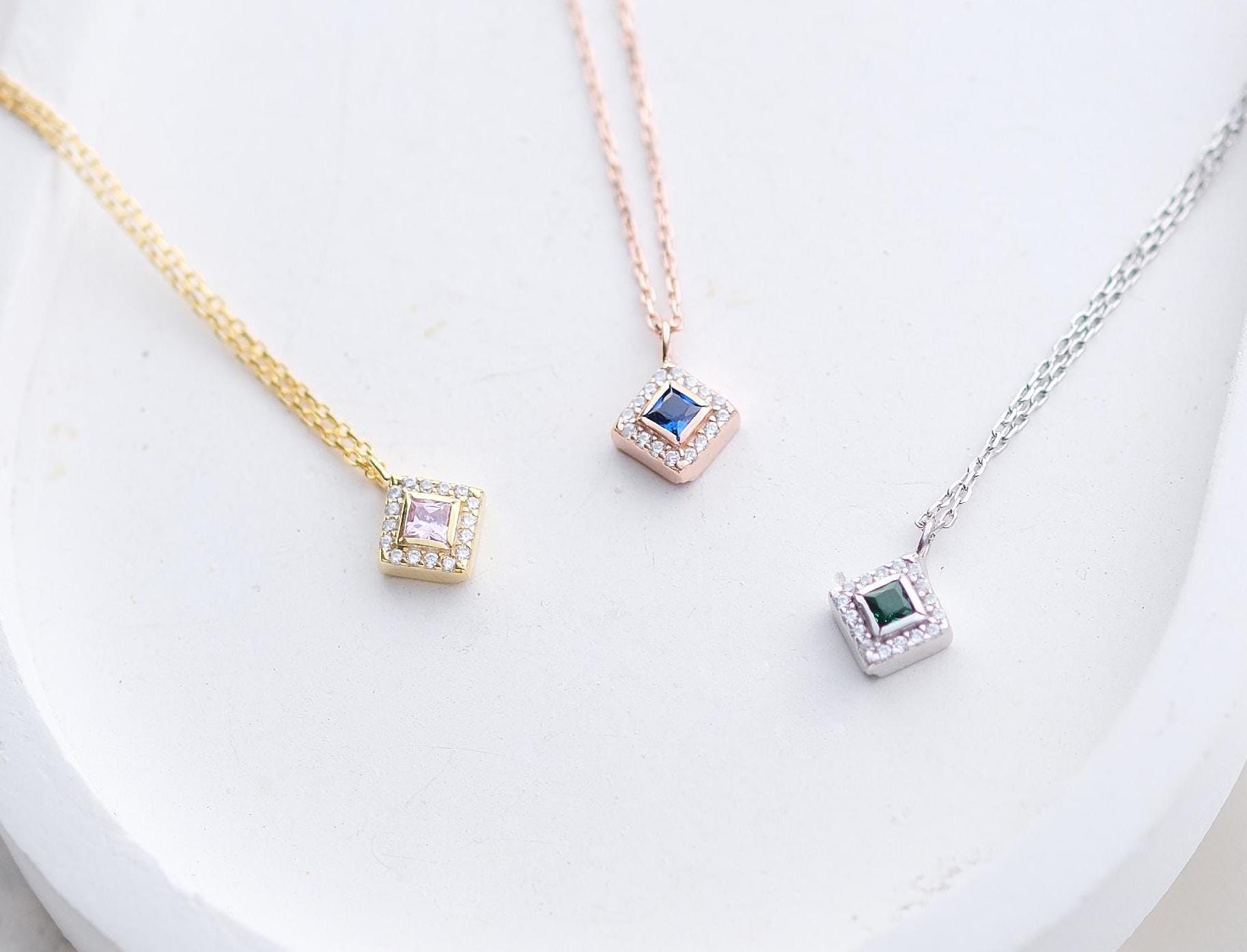 Add a bold touch with our square shaped necklaces adorned with sparkling stones along the edges and inside These stunning customizable pieces offer a blend of elegance and modern style perfect for enhancing your everyday look gifting someone special