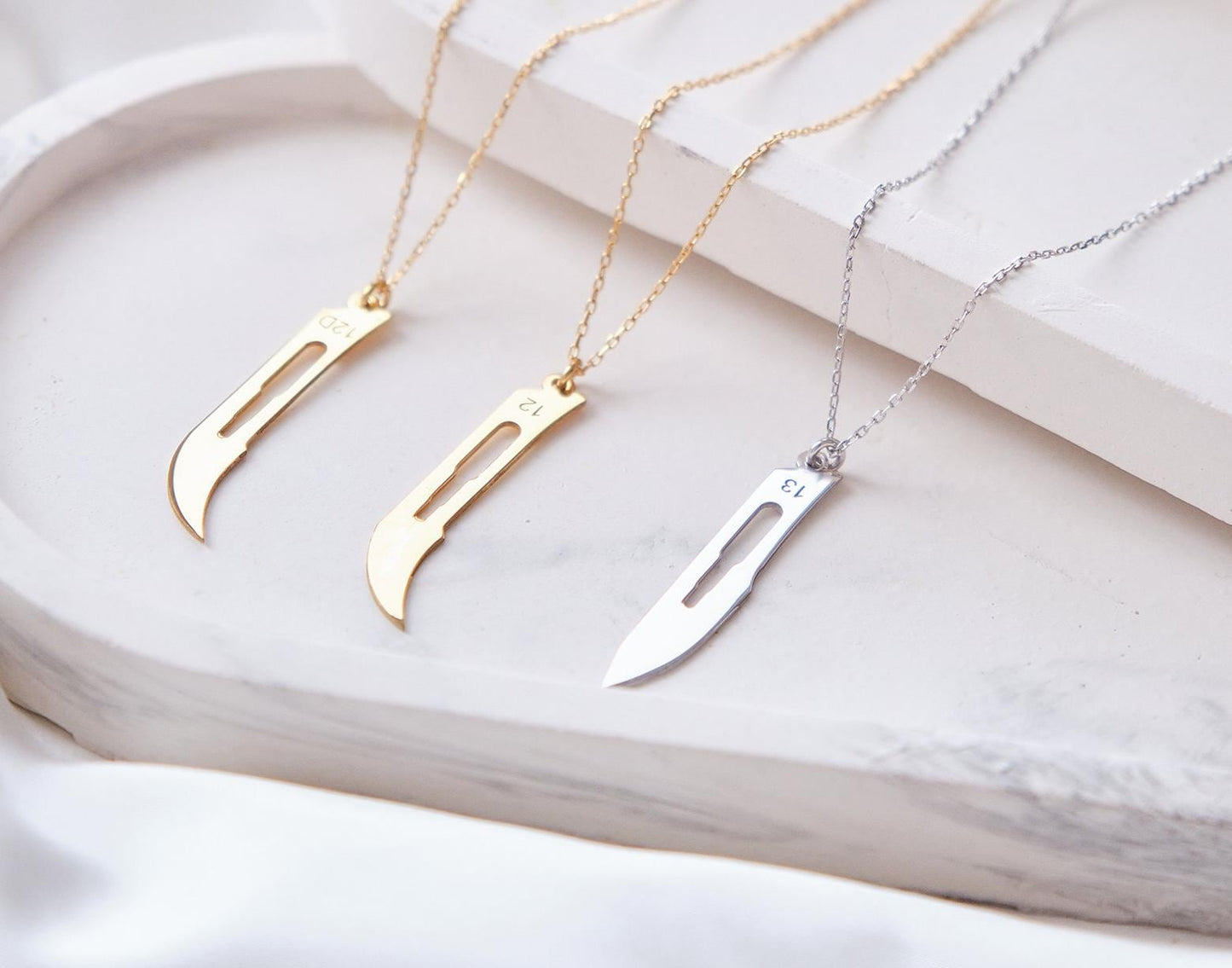 Make a bold statement with our customizable scalpel necklaces! Personalize with your name or a loved one’s, blending unique design with a sharp, modern edge—perfect for those who want to wear something truly distinctive