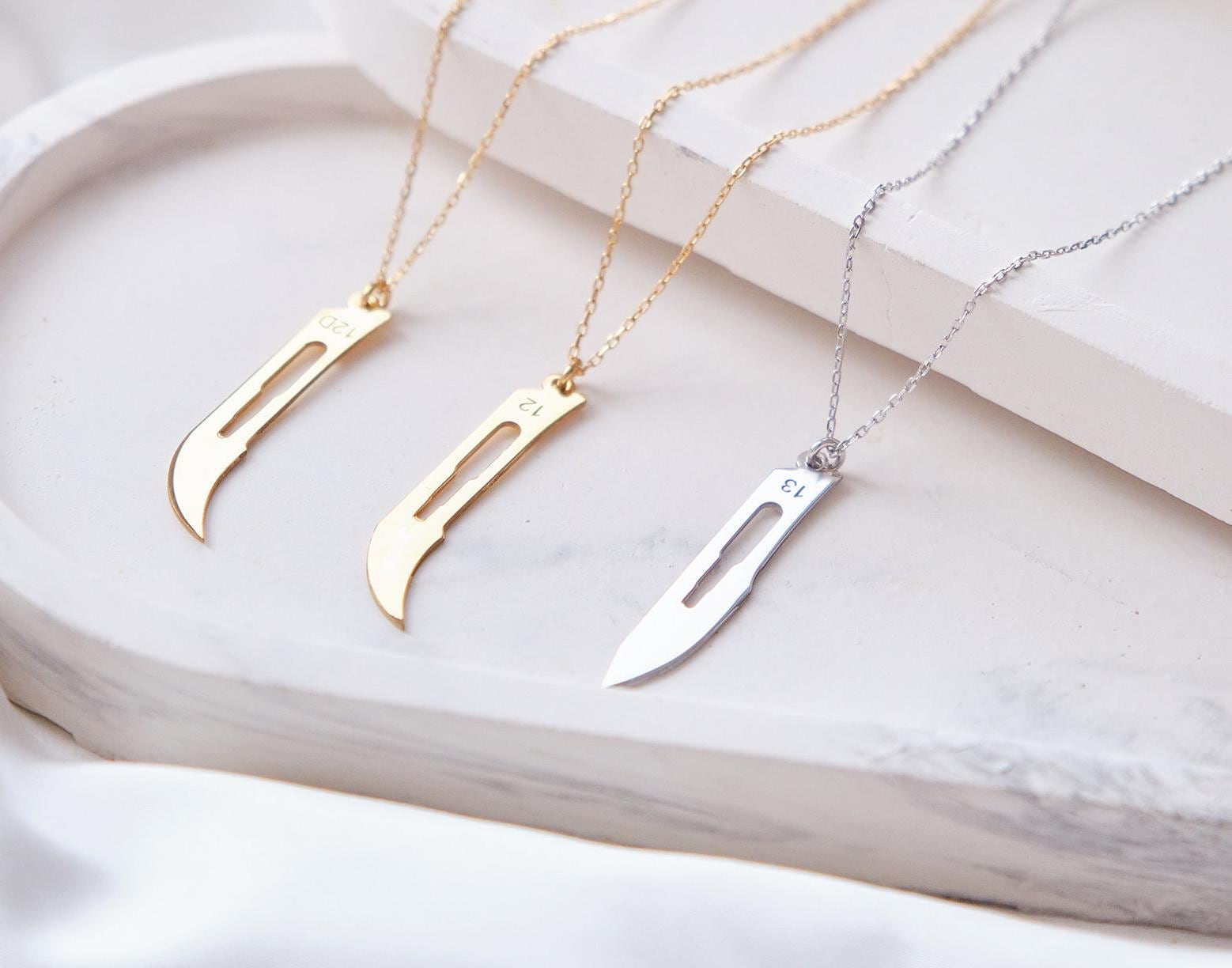 Make a bold statement with our customizable scalpel necklaces! Personalize with your name or a loved one’s, blending unique design with a sharp, modern edge—perfect for those who want to wear something truly distinctive