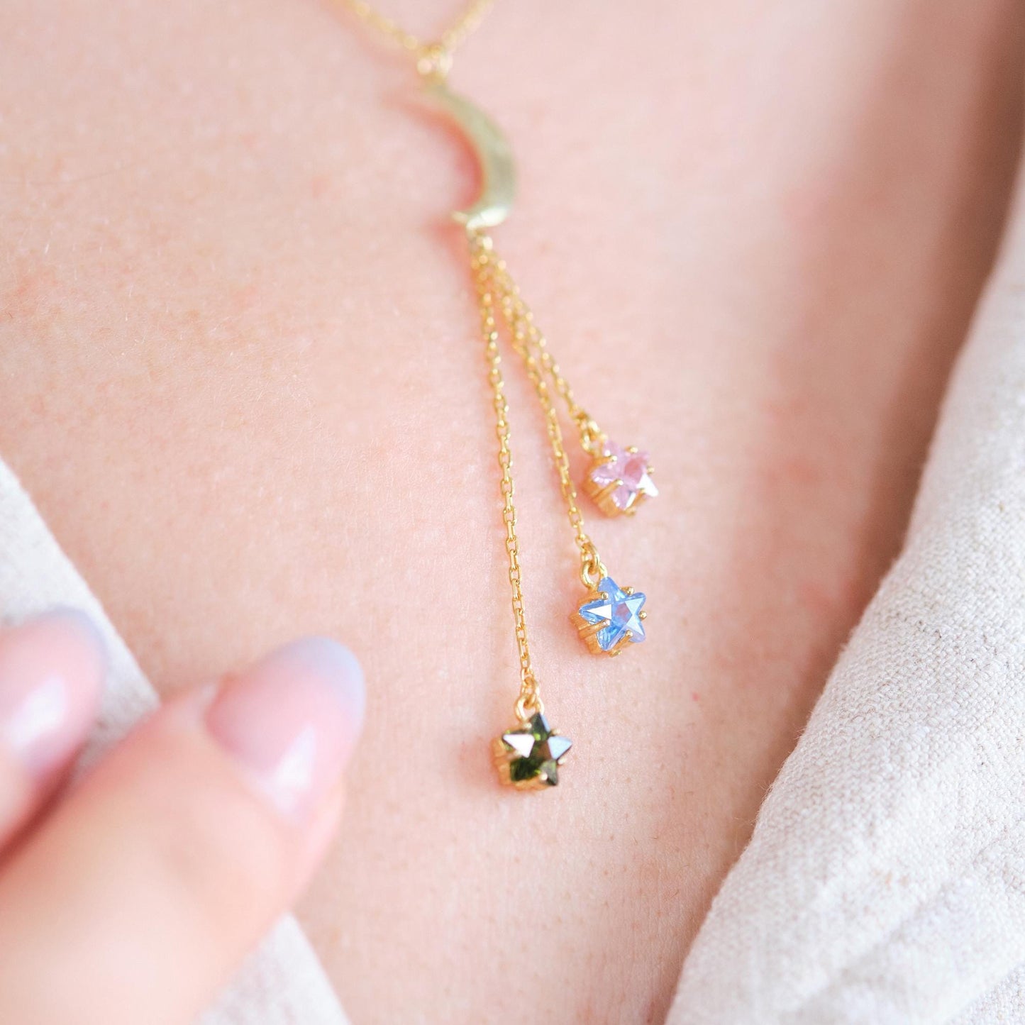 Shine like the night sky with our moon and star necklaces, featuring customizable gemstones at the ends. Choose the stones that reflect your story, creating a piece that’s as unique as the stars themselves