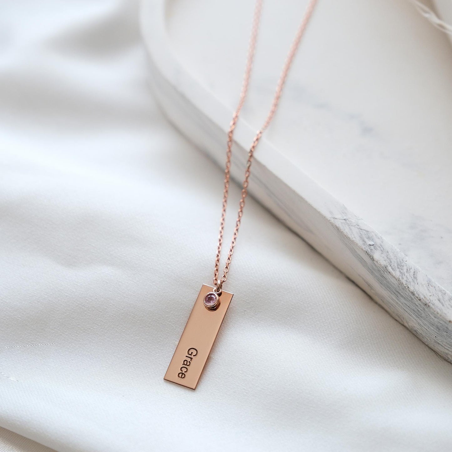 Our customizable bar necklaces with natural gemstones offer elegant personalization with name engraving. Available in gold, silver, and rose gold plating, these durable and stylish pieces perfectly enhance your personal style