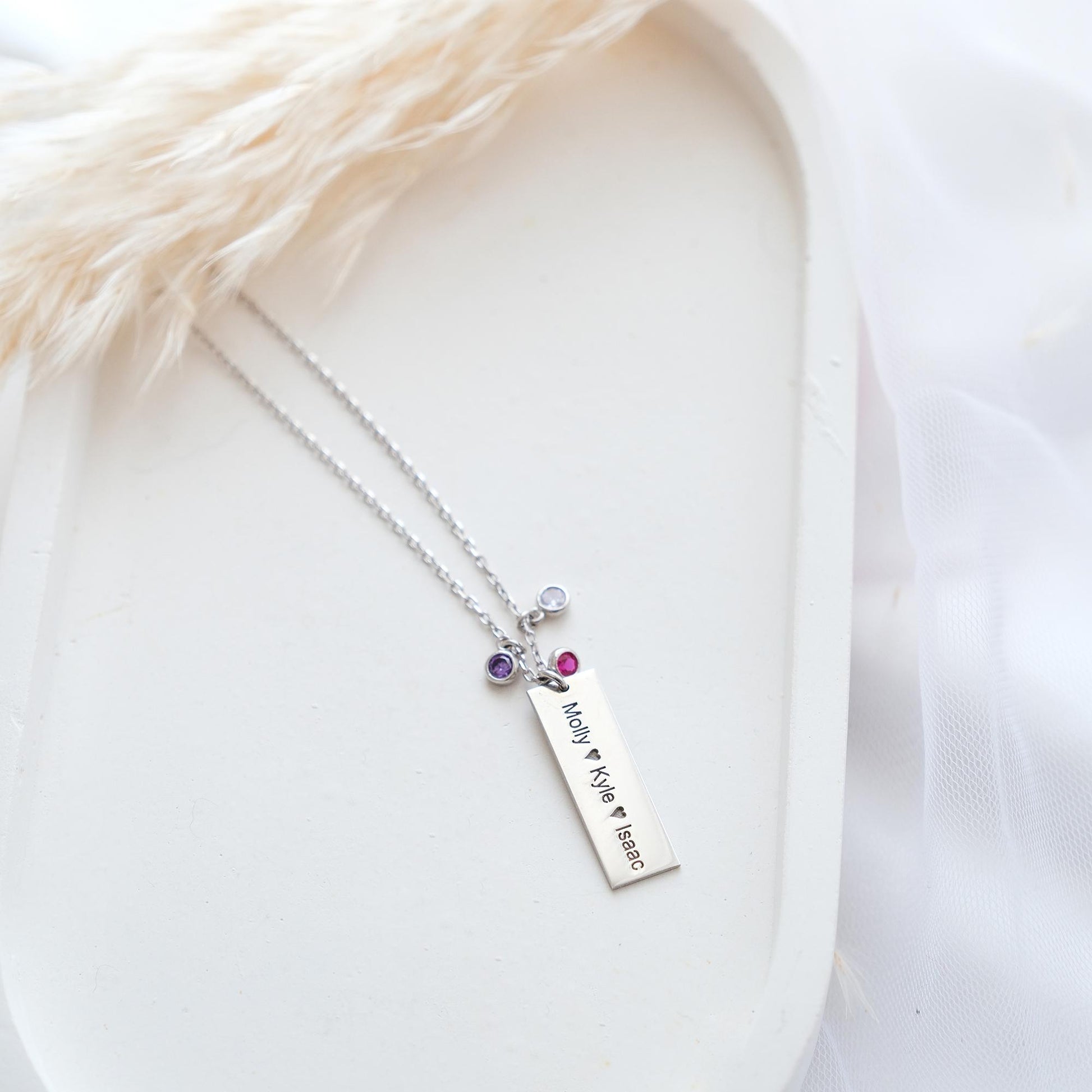 Our customizable bar necklaces with natural gemstones offer elegant personalization with name engraving. Available in gold, silver, and rose gold plating, these durable and stylish pieces perfectly enhance your personal style