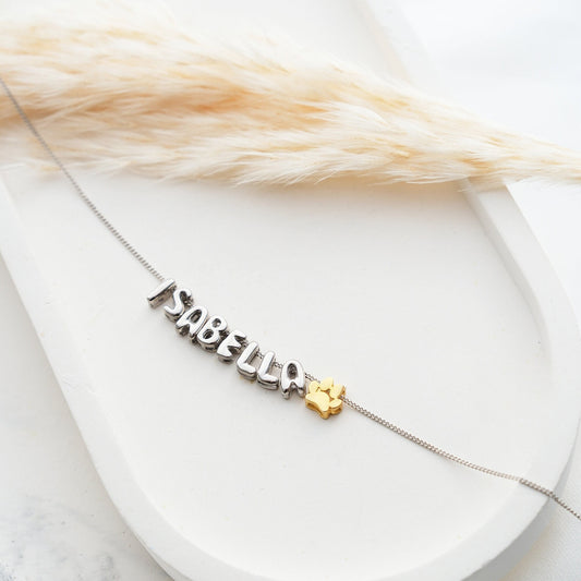Discover our Paw Print and Balloon Necklaces perfect for personalizing with a name The playful paw print and whimsical balloon shapes add a unique touch while customizable engraving makes these pieces truly special Available in gold silver rose gold
