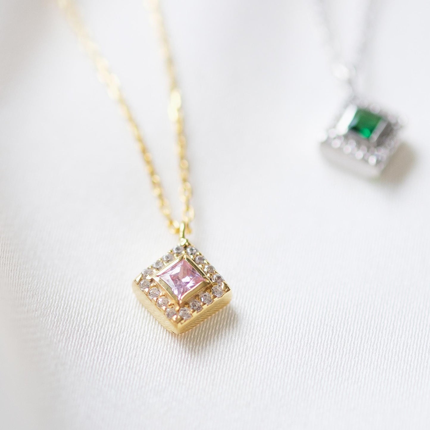 Add a bold touch with our square shaped necklaces adorned with sparkling stones along the edges and inside These stunning customizable pieces offer a blend of elegance and modern style perfect for enhancing your everyday look gifting someone special