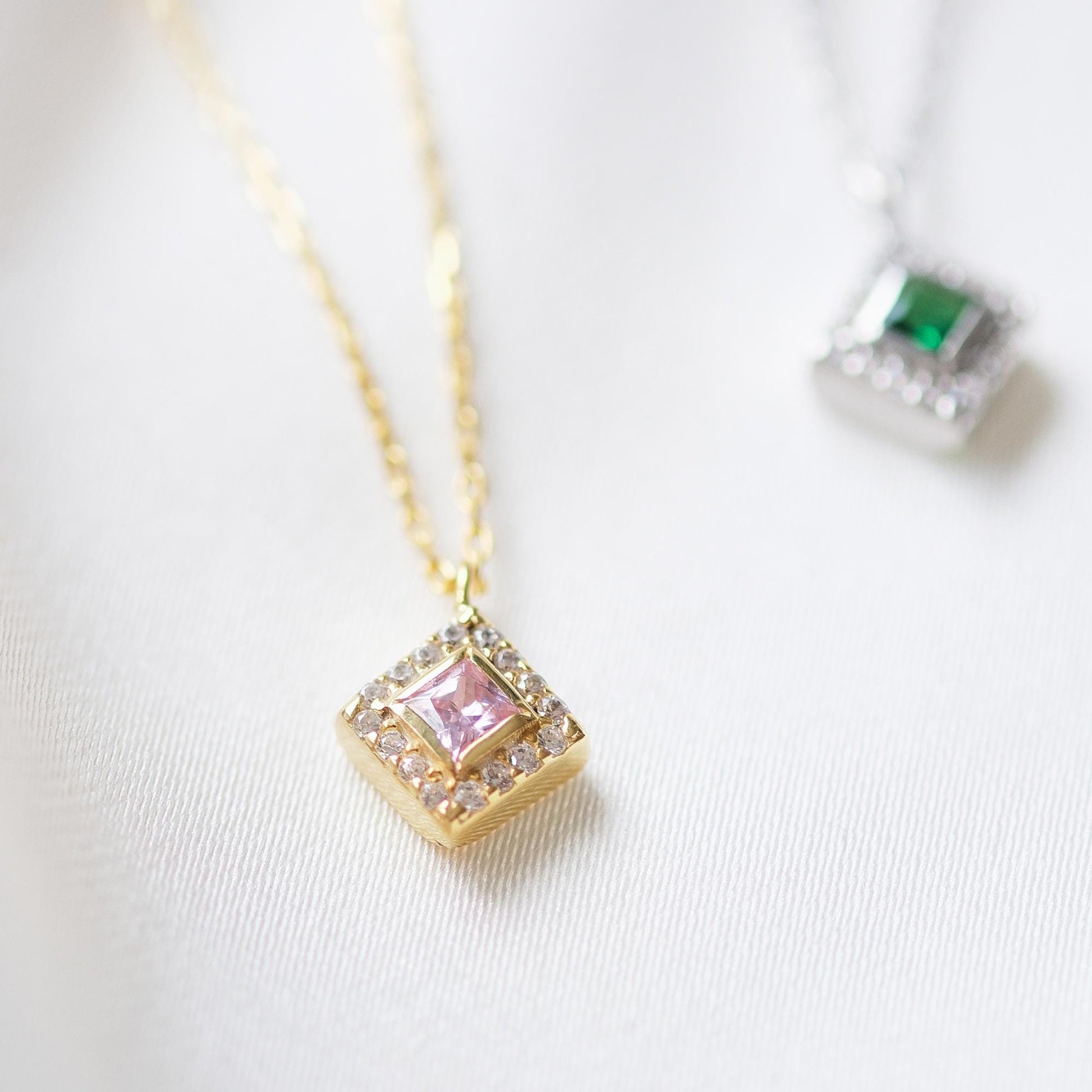 Add a bold touch with our square shaped necklaces adorned with sparkling stones along the edges and inside These stunning customizable pieces offer a blend of elegance and modern style perfect for enhancing your everyday look gifting someone special
