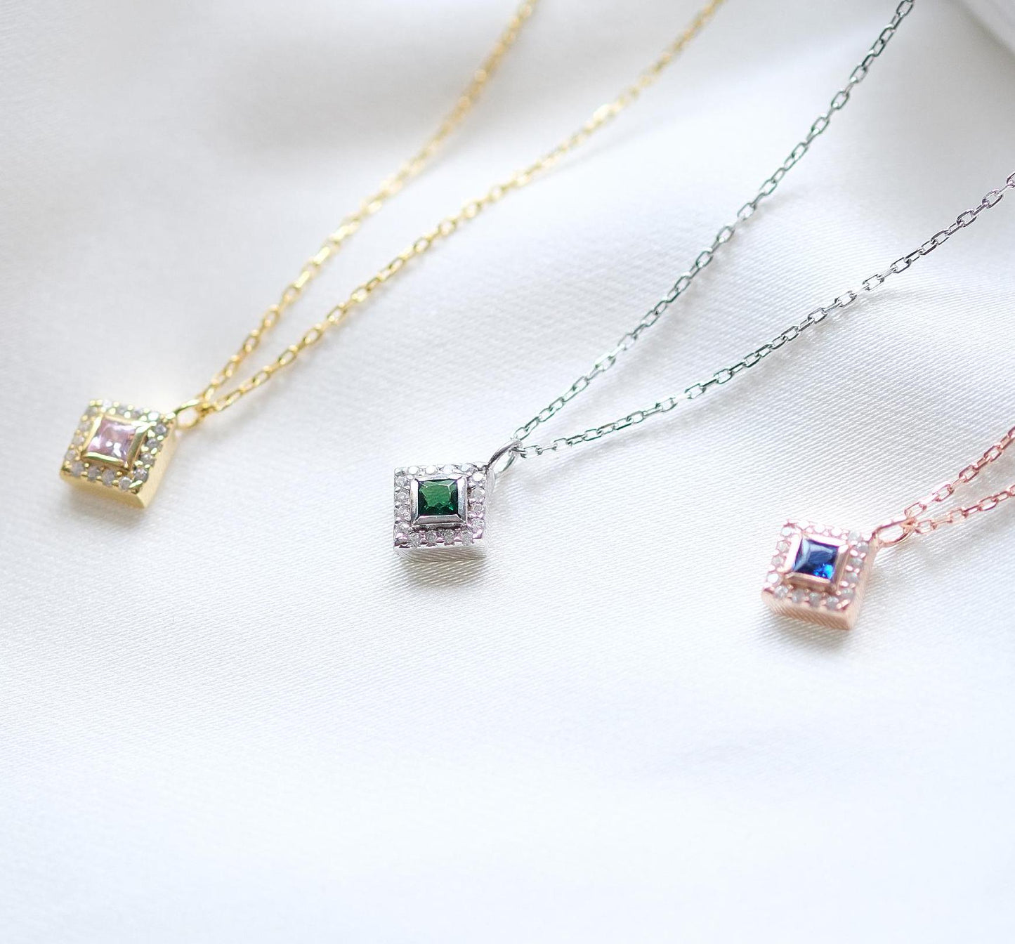 Add a bold touch with our square shaped necklaces adorned with sparkling stones along the edges and inside These stunning customizable pieces offer a blend of elegance and modern style perfect for enhancing your everyday look gifting someone special
