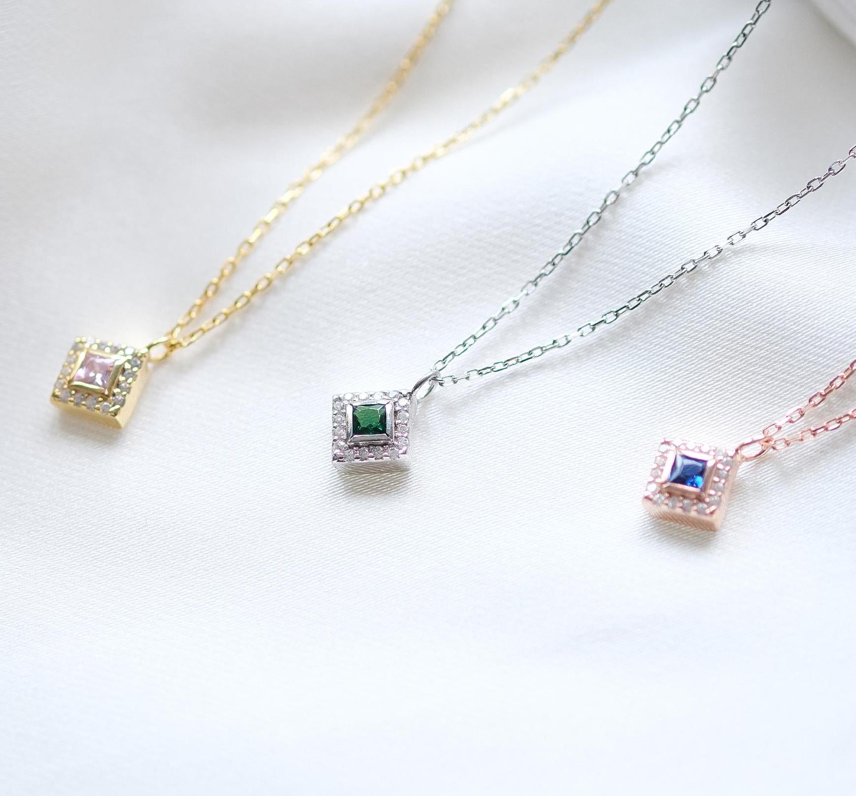 Add a bold touch with our square shaped necklaces adorned with sparkling stones along the edges and inside These stunning customizable pieces offer a blend of elegance and modern style perfect for enhancing your everyday look gifting someone special