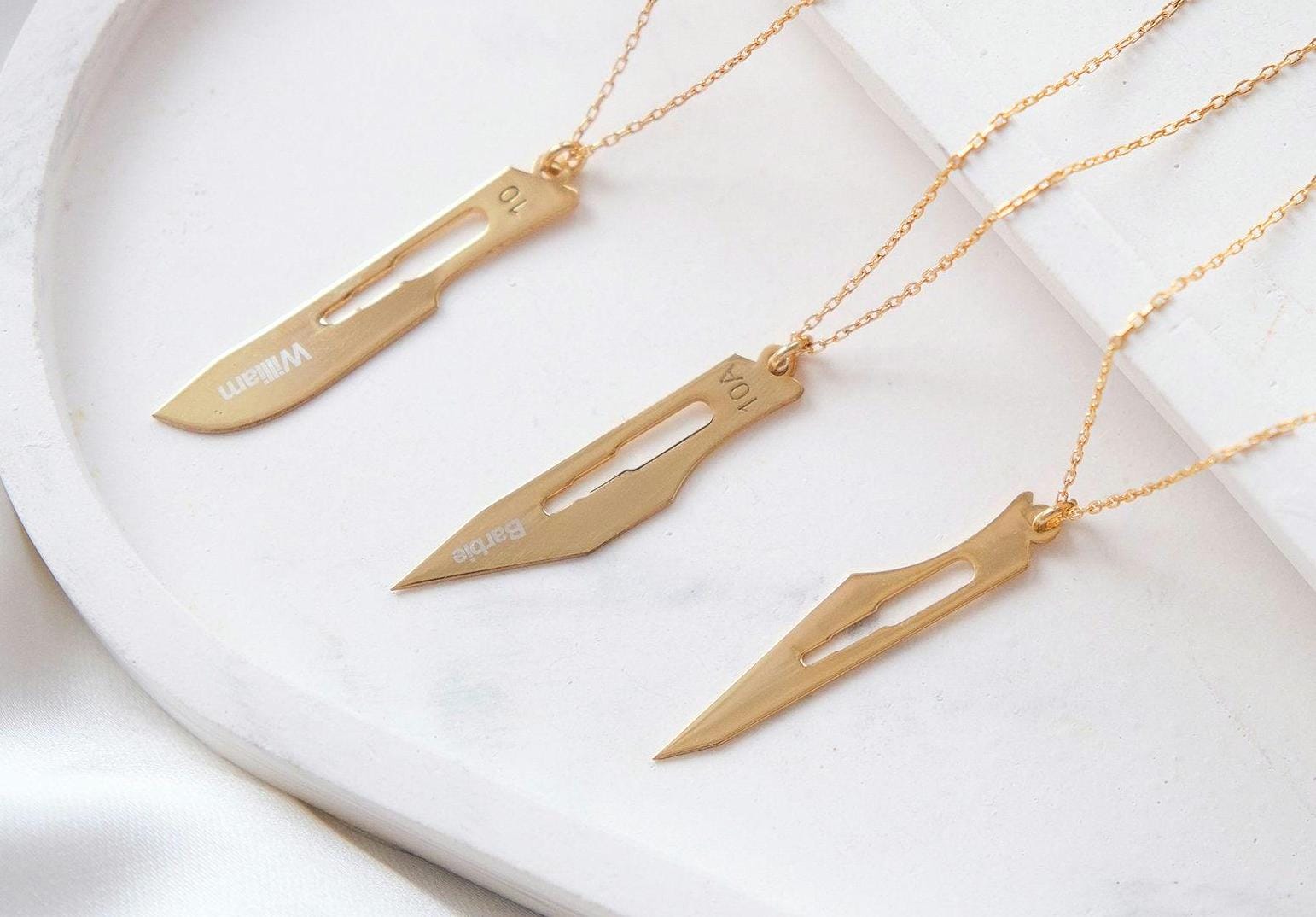 Make a bold statement with our customizable scalpel necklaces! Personalize with your name or a loved one’s, blending unique design with a sharp, modern edge—perfect for those who want to wear something truly distinctive