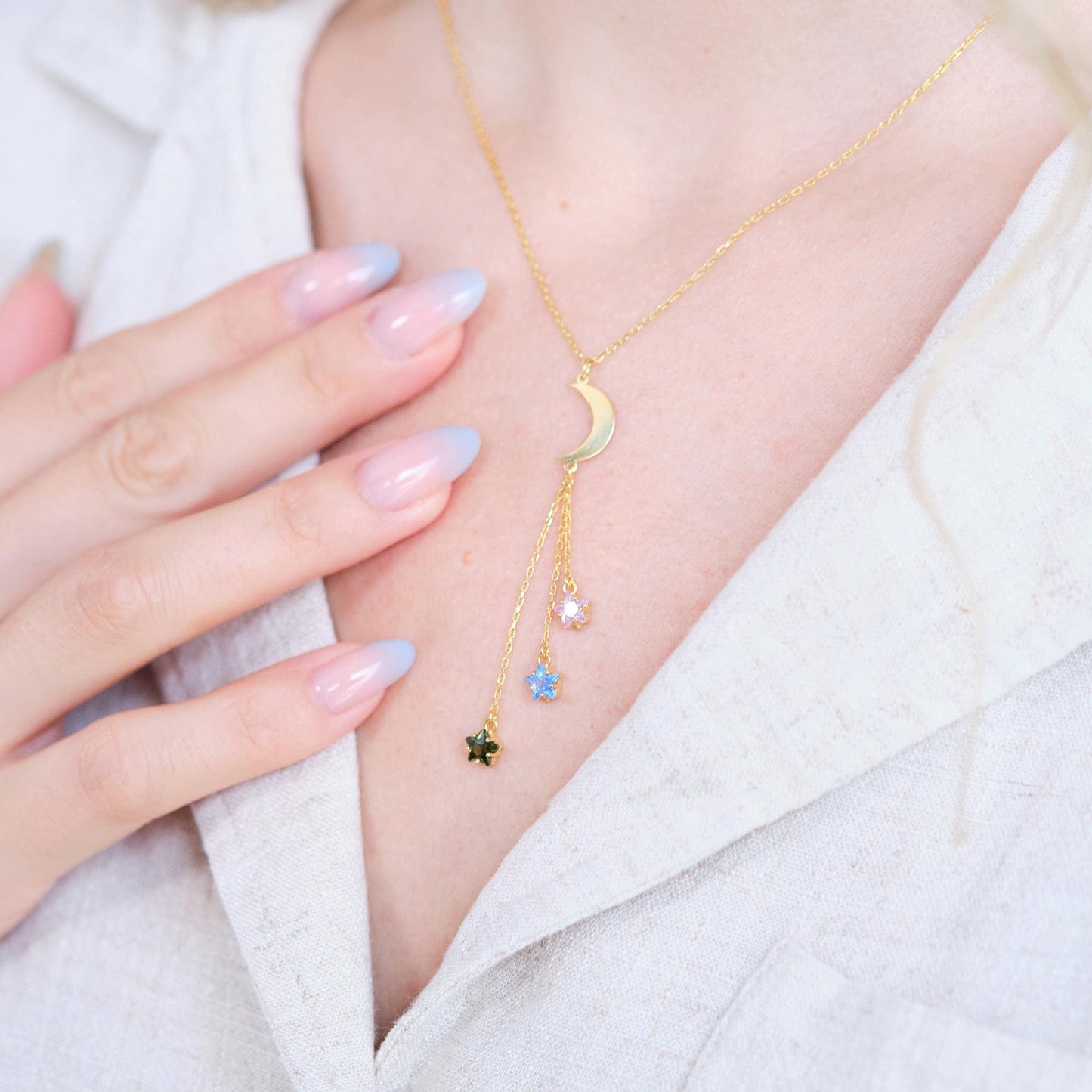 Shine like the night sky with our moon and star necklaces, featuring customizable gemstones at the ends. Choose the stones that reflect your story, creating a piece that’s as unique as the stars themselves