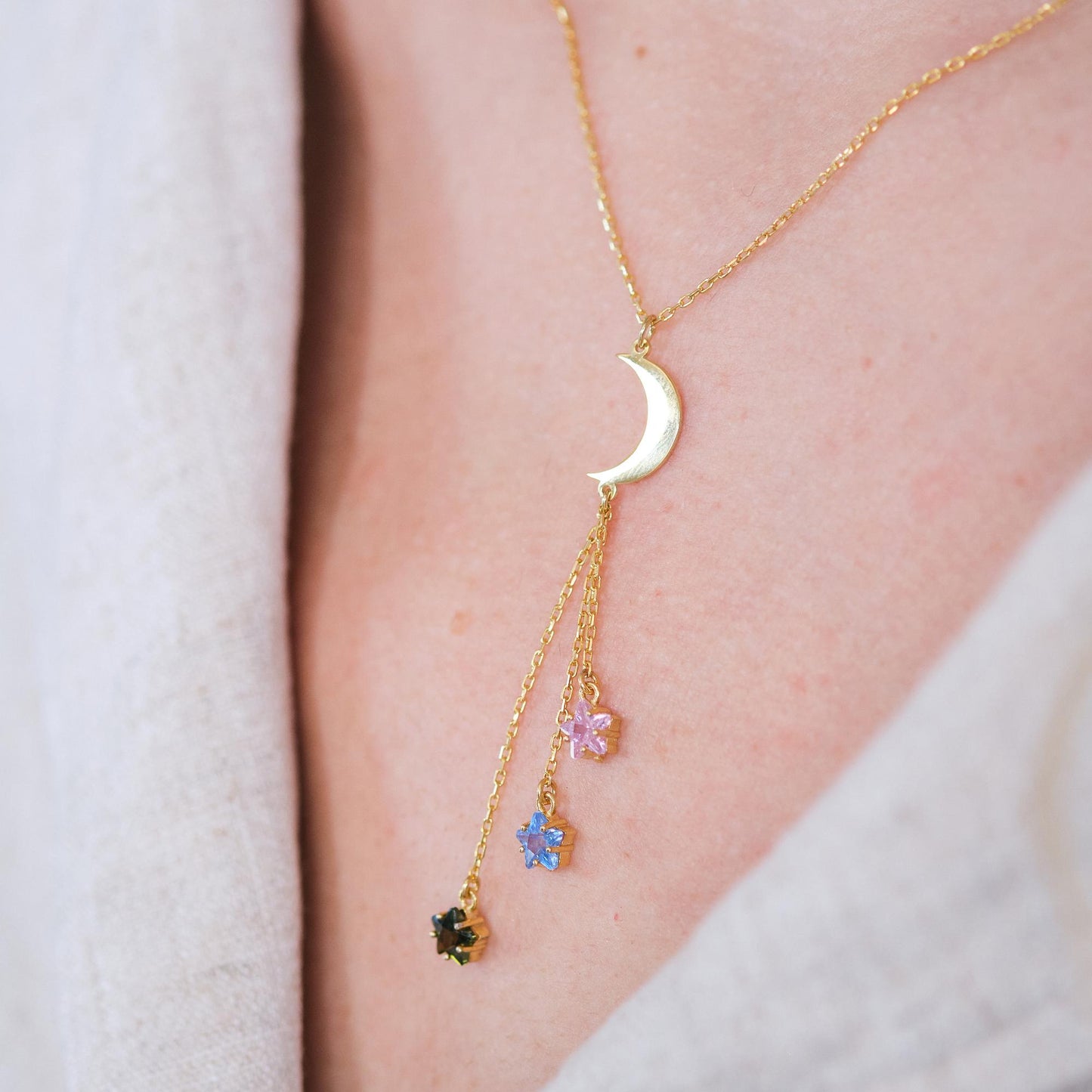 Shine like the night sky with our moon and star necklaces, featuring customizable gemstones at the ends. Choose the stones that reflect your story, creating a piece that’s as unique as the stars themselves