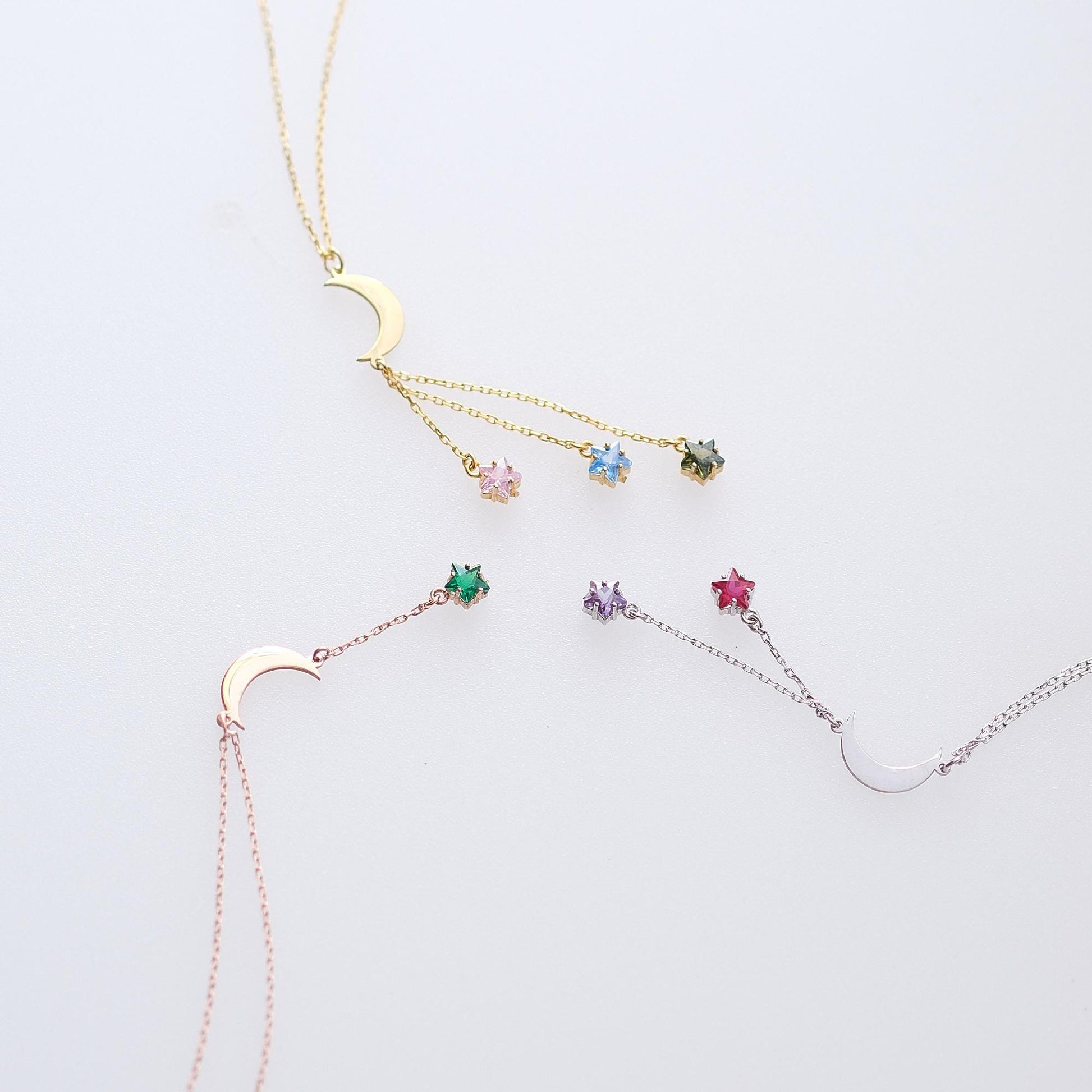 Shine like the night sky with our moon and star necklaces, featuring customizable gemstones at the ends. Choose the stones that reflect your story, creating a piece that’s as unique as the stars themselves