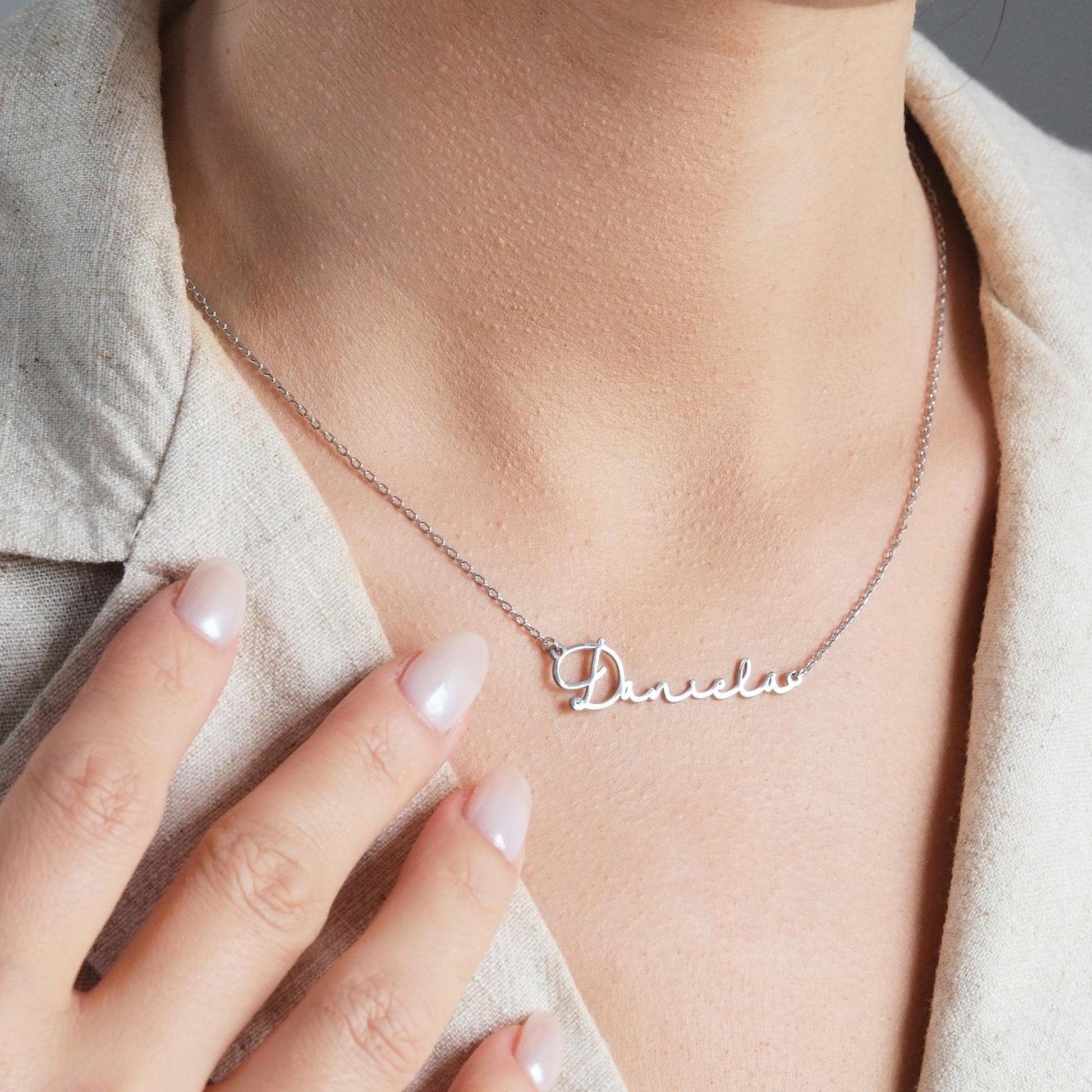 Present your loved ones with a unique gift through our customizable name necklaces. Available in gold, silver, and rose gold plating, these elegant and durable designs perfectly complement personal style. Add your name, and leave a lasting impression
