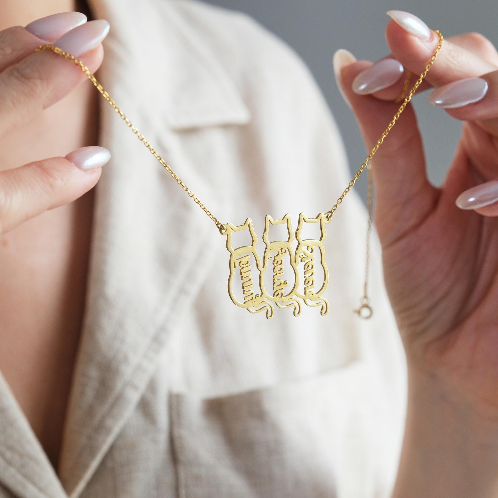 The Cat-Shaped Necklace is a stylish, playful piece perfect for cat lovers. It features a charming cat silhouette that can be personalized with a name of your choice. Available in silver, gold, and rose gold, this unique accessory adds a personal