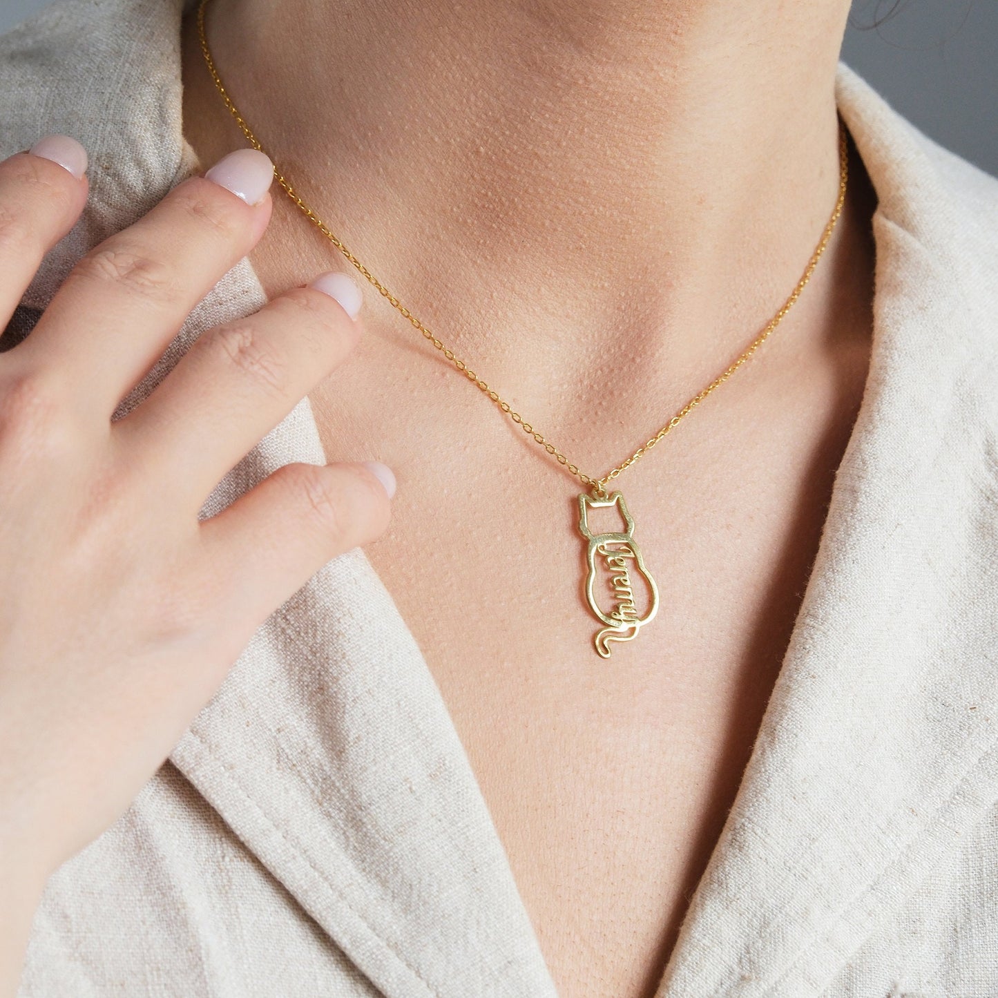 The Cat-Shaped Necklace is a stylish, playful piece perfect for cat lovers. It features a charming cat silhouette that can be personalized with a name of your choice. Available in silver, gold, and rose gold, this unique accessory adds a personal