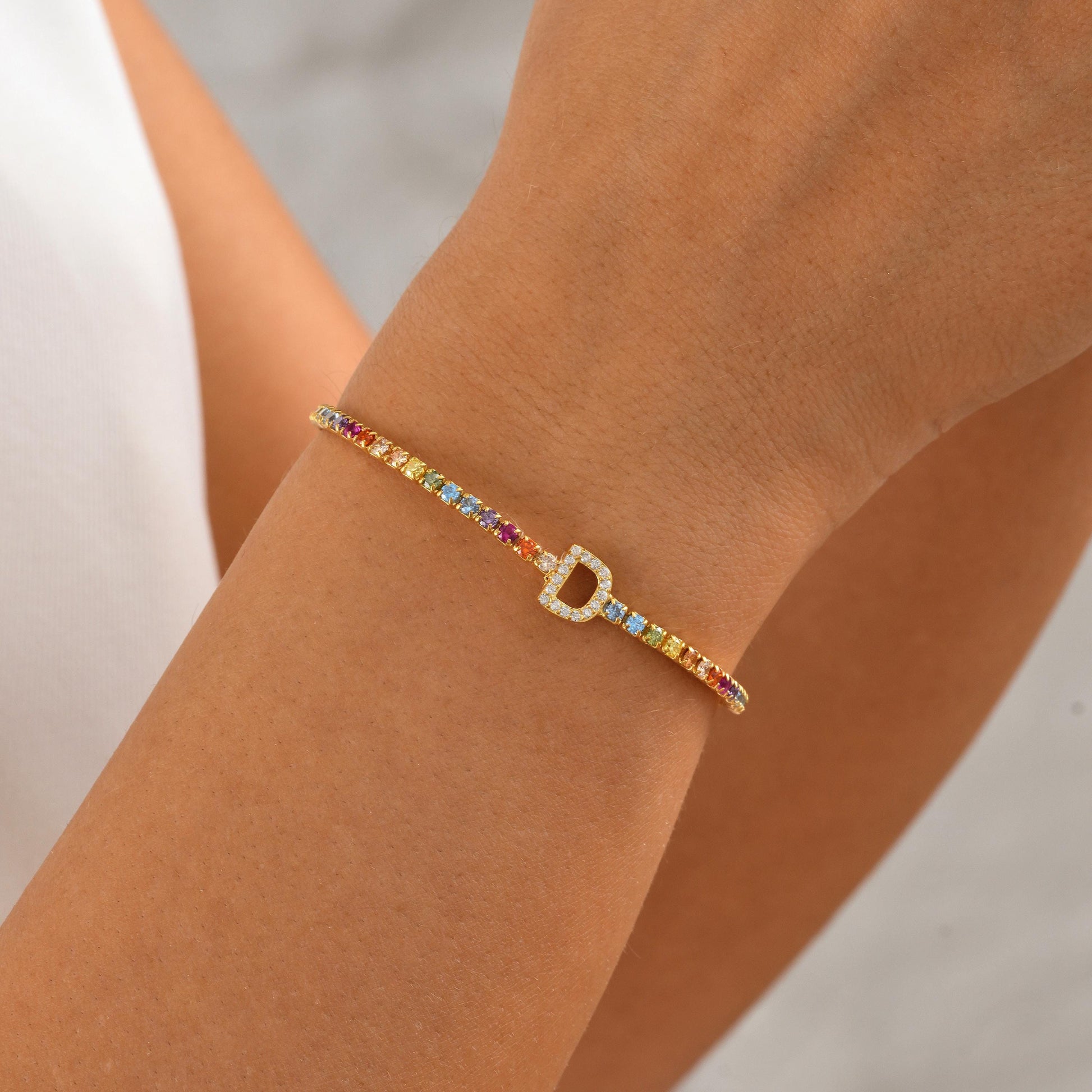 Material: 925 Sterling Silver or 14K Solid Gold
Finish: High-polish
 Stone: AAA+ Cubic Zirconia
Charm: Single initial letter (A–Z)
Length: Adjustable (5&quot;-9&quot;)
Hypoallergenic & nickel-free
Handmade with precision
Personalized Gifts  Birthday  Bridesmaids Graduation  Dainty Luxury Lovers – Gift for Her  Everyday Elegance Elegant gift box
Ready for gifting with optional message
Processing time: 2–3 business days
Ships from Turkey (for EU orders)
USA: 2–5 business days
Europe: 1–3 business days