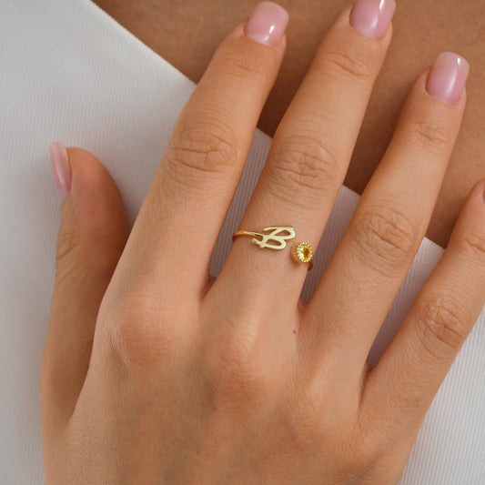 Sterling silver and gold personalized initial rings with sparkling birthstones