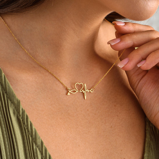 Material: 925K Sterling Silver / 14K Solid Gold  
• Finish Options: Silver, Gold, Rose Gold  
• Pendant: Heart + ECG + Stethoscope silhouette with custom name  
• Chain Length: Adjustable (16&quot; + 2&quot; extender)  
• Closure: Spring Ring  

🎯 Perfect For:  
Nurses – Doctors – Graduation – Residency match – White coat gift – Healthcare workers – Personalized medical gifts