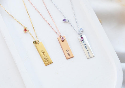 Our customizable bar necklaces with natural gemstones offer elegant personalization with name engraving. Available in gold, silver, and rose gold plating, these durable and stylish pieces perfectly enhance your personal style