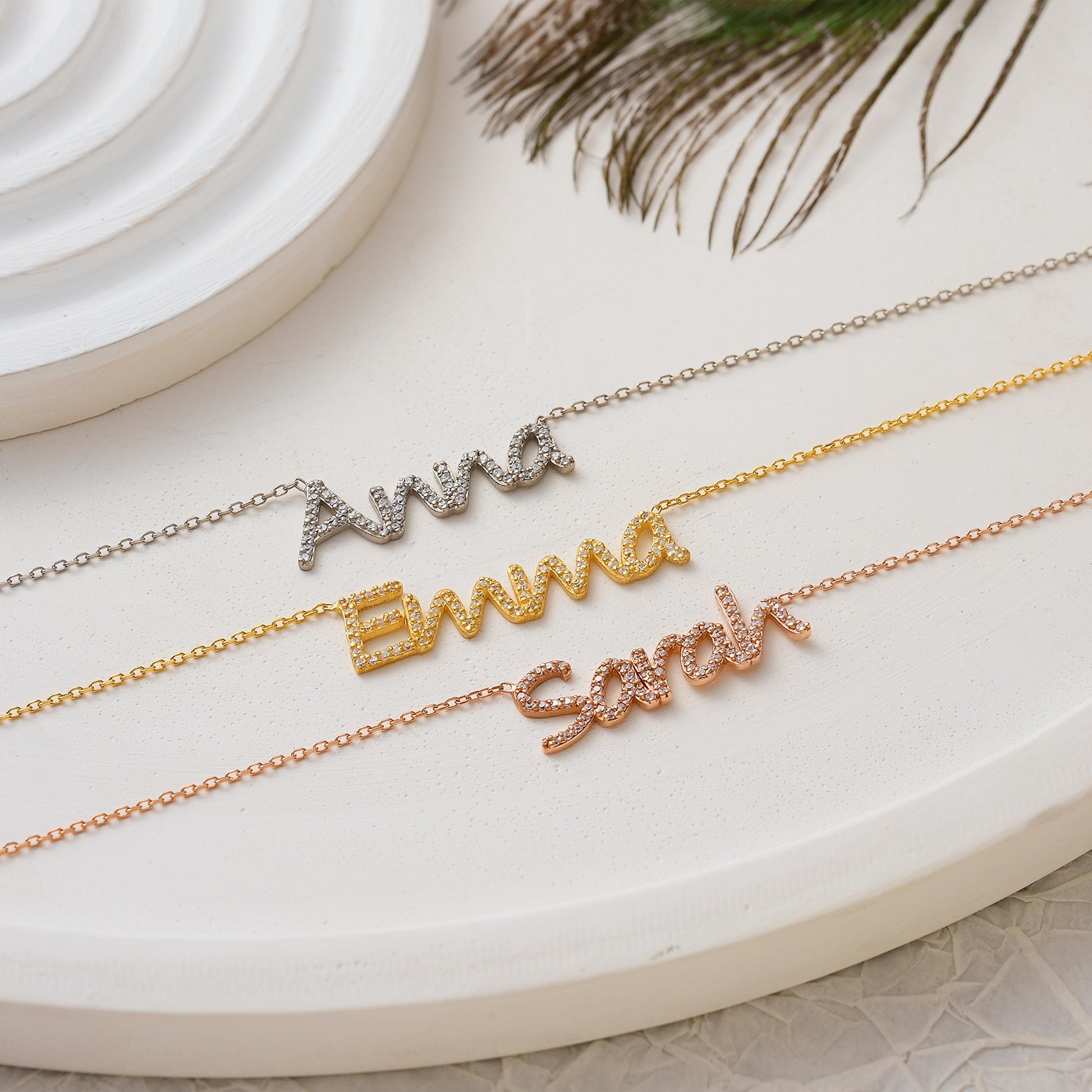 ✨ CZ Name Necklace – Dainty, Sparkly, Personalized ✨  

This elegant name necklace is custom-made with shimmering cubic zirconia stones for a touch of everyday glam. Whether it’s your own name or a loved one’s, this piece is crafted in 925K Sterling Silver / 14K Solid Gold and makes a heartfelt gift they’ll treasure.