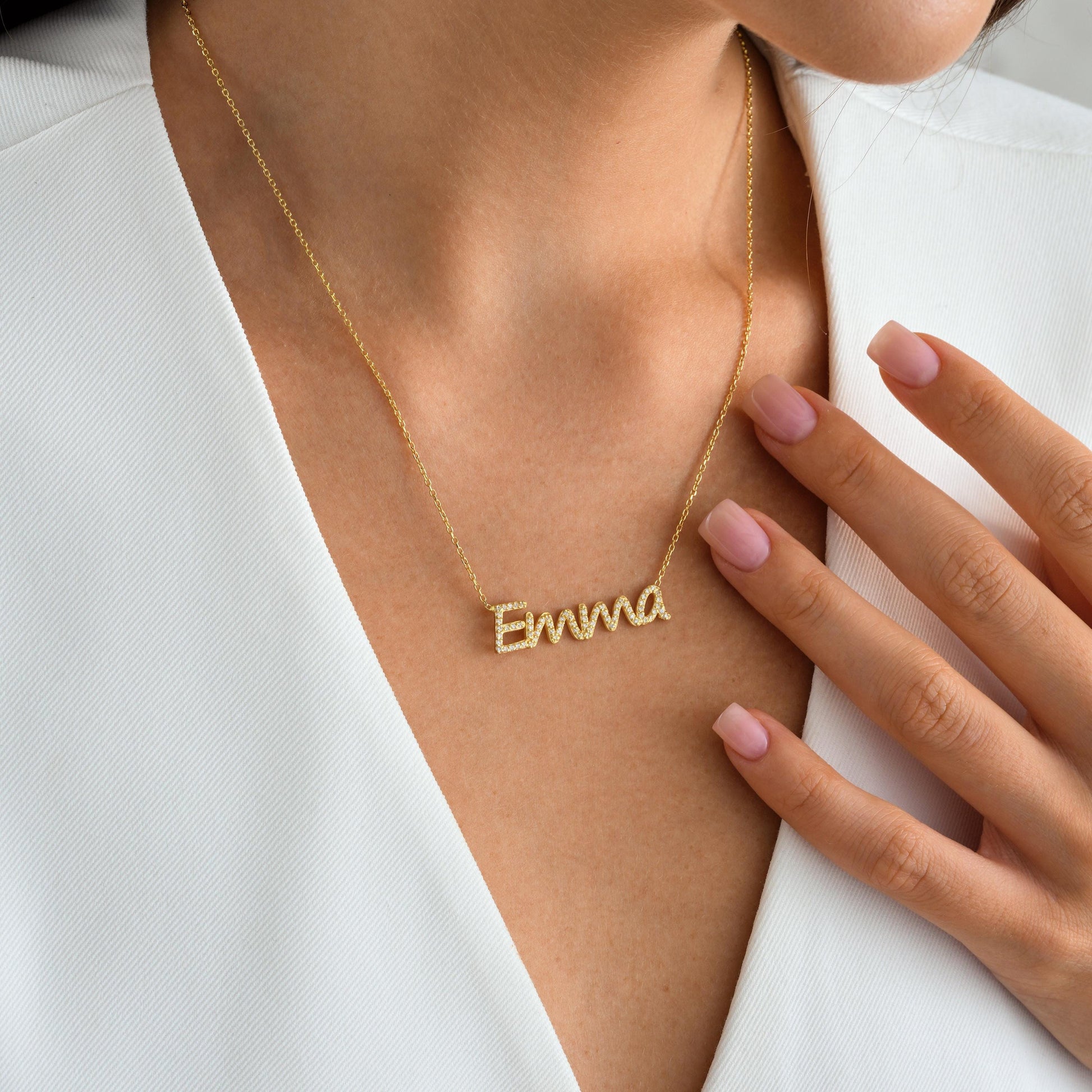 ✨ CZ Name Necklace – Dainty, Sparkly, Personalized ✨  

This elegant name necklace is custom-made with shimmering cubic zirconia stones for a touch of everyday glam. Whether it’s your own name or a loved one’s, this piece is crafted in 925K Sterling Silver / 14K Solid Gold and makes a heartfelt gift they’ll treasure.