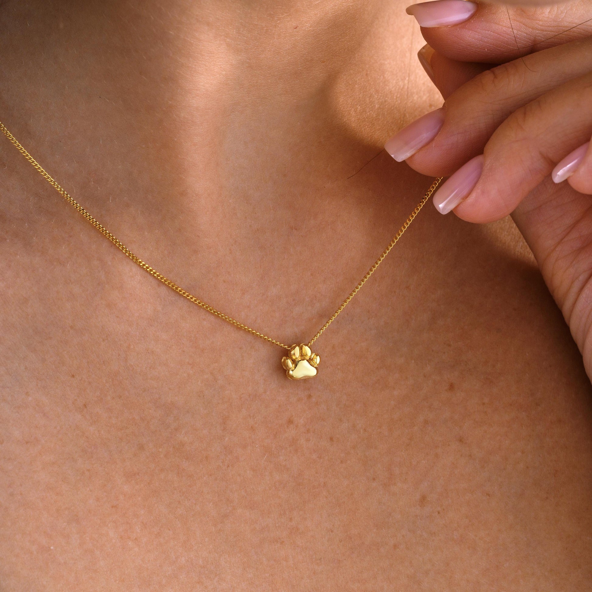 Custom Paw Print Pendant Necklace – Personalized Pet Memorial Jewelry ✨  

A beautiful and meaningful necklace featuring a 3D paw print charm, perfect for honoring your beloved pet or gifting to an animal lover. A timeless keepsake to cherish forever.

💛 Product Details  
• Material: 925K Sterling Silver / 14K Solid Gold  
• Closure: Spring Ring  
• Pendant Size: Approx. 10mm  
• Sold as: Pendant with chain included  
• Hypoallergenic & safe for sensitive skin
