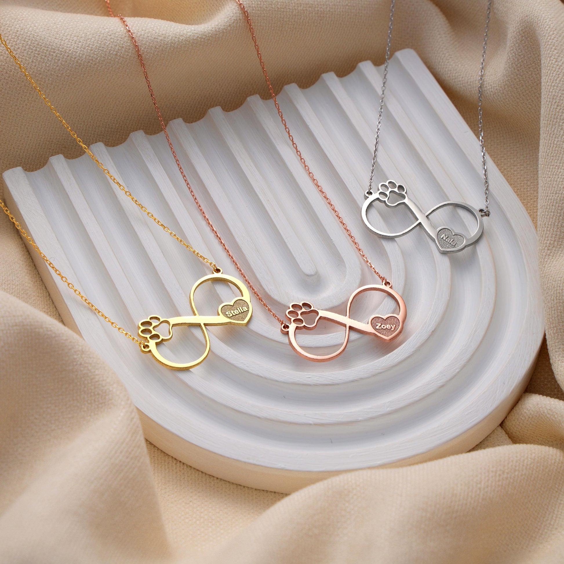 ✨ Custom Eternity Paw Necklace – Personalized Pet Name Pendant ✨  

A unique infinity design blending a paw print and a heart, symbolizing endless love for your furry friend. Perfect as a gift for pet lovers or a meaningful keepsake for yourself.

💛 Product Details  
• Material: 925K Sterling Silver / 14K Solid Gold  
• Closure: Spring Ring  
• Pendant Size: Approx. 25mm  
• Sold as: Pendant with chain included  
• Hypoallergenic & safe for sensitive skin