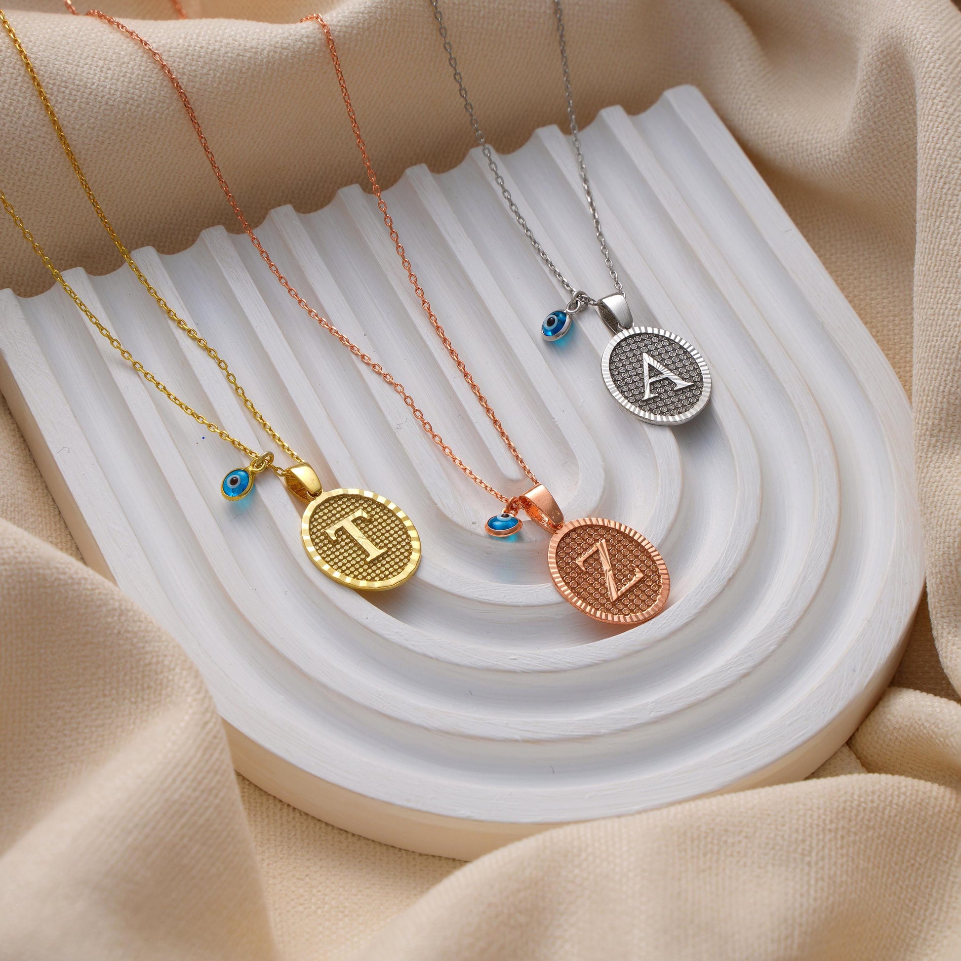 ✨ Initial Pendant Necklace with Evil Eye Charm – Personalized Jewelry ✨

A stunning necklace featuring an elegant initial pendant paired with a protective evil eye charm. Perfect as a meaningful gift or stylish everyday accessory.

🎯 Perfect For:
Birthdays, anniversaries, good luck gifts, protection jewelry, or self-love pieces.

💛 Product Details
• Material: 925K Sterling Silver / 14K Solid Gold
• Closure: Spring Ring
• Pendant Size: Approx. 15mm
• Hypoallergenic & safe for sensitive skin