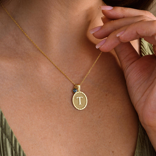 ✨ Initial Pendant Necklace with Evil Eye Charm – Personalized Jewelry ✨

A stunning necklace featuring an elegant initial pendant paired with a protective evil eye charm. Perfect as a meaningful gift or stylish everyday accessory.

🎯 Perfect For:
Birthdays, anniversaries, good luck gifts, protection jewelry, or self-love pieces.

💛 Product Details
• Material: 925K Sterling Silver / 14K Solid Gold
• Closure: Spring Ring
• Pendant Size: Approx. 15mm
• Hypoallergenic & safe for sensitive skin