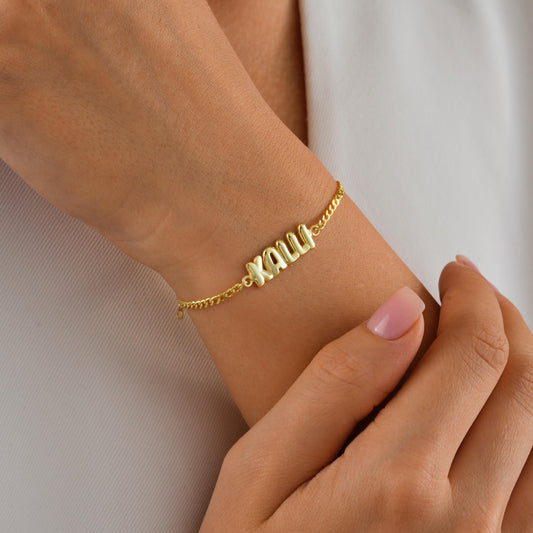 Material: 925 Sterling Silver or 14K Solid Gold
Finish: High-polish
Chain: Gourmet chain with secure lobster clasp
Name: Custom balloon-style lettering 
Length: Adjustable (5&quot;-9&quot;)
Hypoallergenic & nickel-free
Handmade with love
Personalized Gifts Birthday Bridesmaids Everyday Minimalist Style  Name Jewelry Lovers
Elegant gift box
Ready for gifting with personalized note option
Processing time: 2–3 business day Ships from Turkey (for EU orders)
USA 2–5 business days
 Europe 1–3 business days