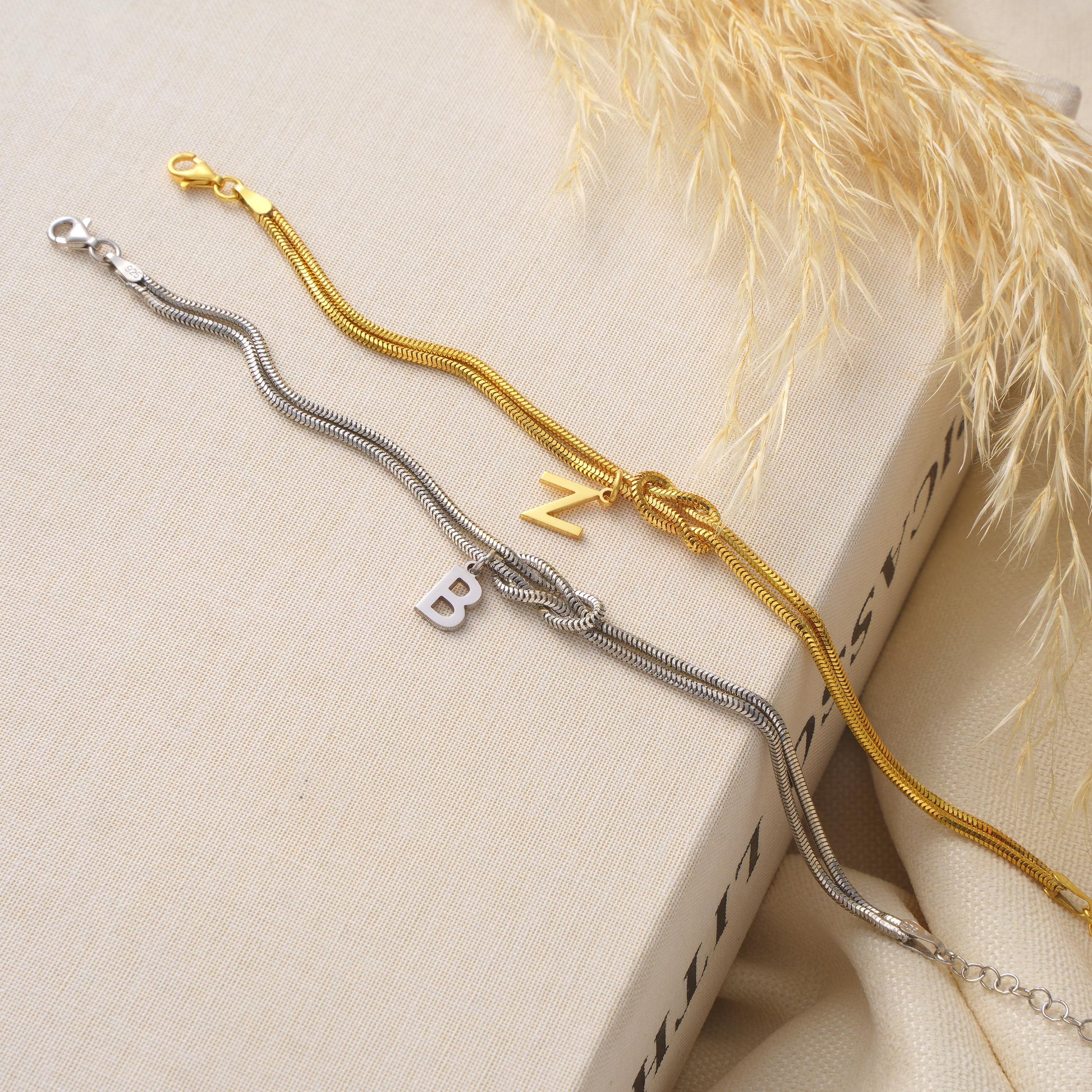 Material: 925 Sterling Silver or 14K Solid Gold
Finish: High-polish
Design: Knotted double chain with initial charm
Initial: A–Z (1 letter)
Length: Adjustable 5&quot;-9&quot;
Closure: Lobster clasp
Hypoallergenic nickel-free
Handmade with care
Everyday Wear  Personalized Gifts  Graduation  Bridesmaids  Gift for Her  Minimalist Style
Elegant gift box
Ready for gifting with optional message card
Processing time 2–3 business days
Ships from Turkey for EU buyers
USA 2–5 business days
Europe 1 3 business days