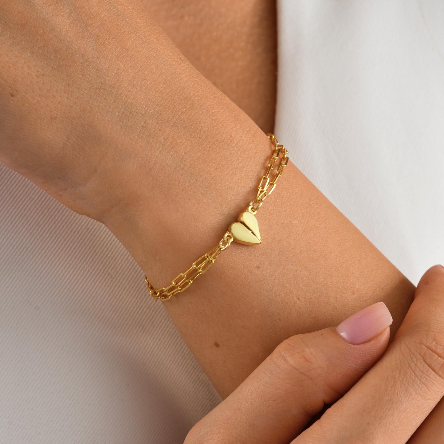 Material 925 Sterling Silver  14K Solid Gold  Rose Gold Silver
Finish High polish
Design Magnetic heart that forms a whole when placed together
Chain Paperclip-style chain
Adjustable 5&quot; 9&quot;
Closure Lobster clasp
Hypoallergenic nickel free
Handmade 
Couple Bracelets  Long-Distance Lovers Best Friends  Anniversary Gifts  Valentine Day
2 individual bracelets 1 set
gift packaging
Ready for gifting with optional note card
Processing time 2 3 business days
USA 2 5 business day
Europe 1 3 business day