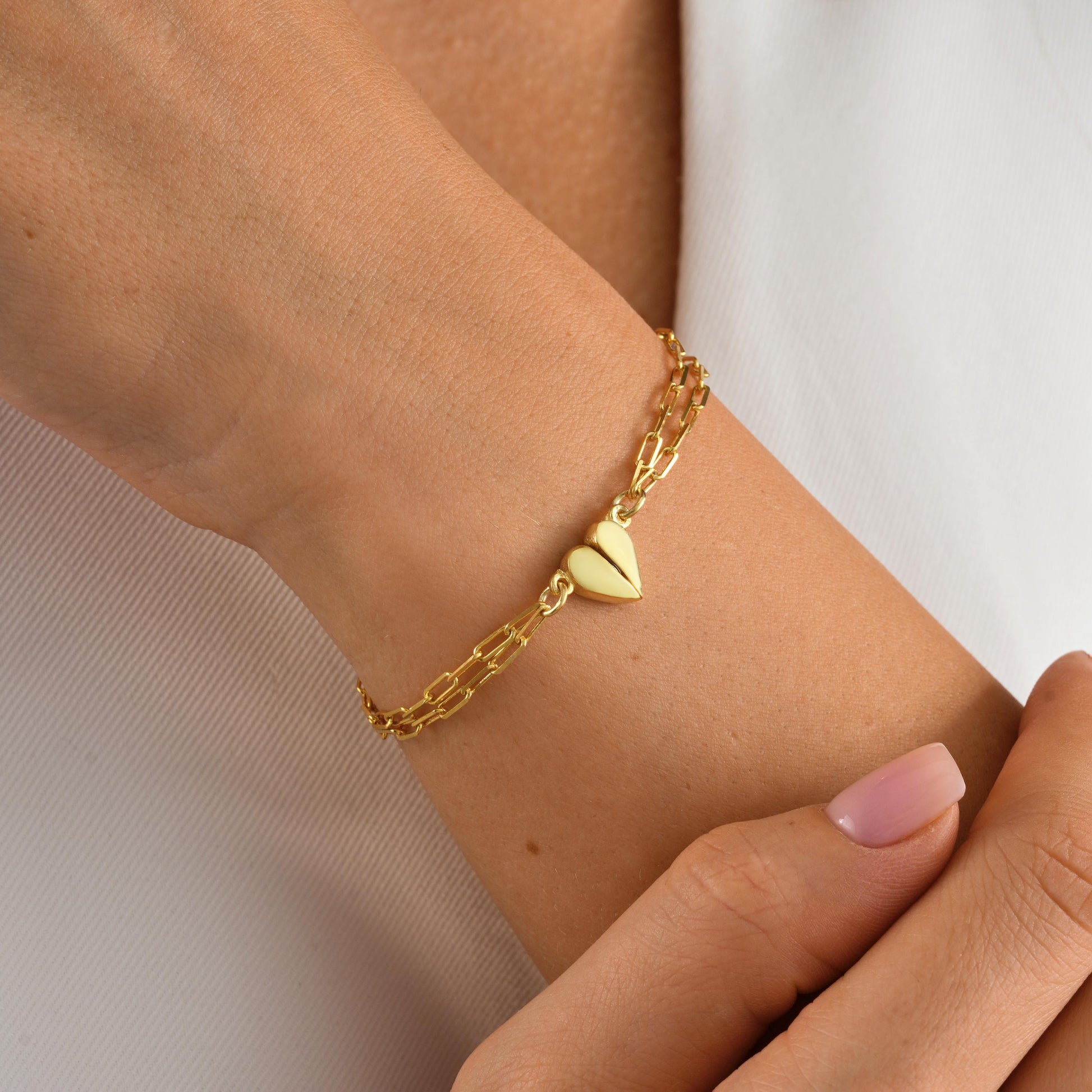 Material 925 Sterling Silver  14K Solid Gold  Rose Gold Silver
Finish High polish
Design Magnetic heart that forms a whole when placed together
Chain Paperclip-style chain
Adjustable 5&quot; 9&quot;
Closure Lobster clasp
Hypoallergenic nickel free
Handmade 
Couple Bracelets  Long-Distance Lovers Best Friends  Anniversary Gifts  Valentine Day
2 individual bracelets 1 set
gift packaging
Ready for gifting with optional note card
Processing time 2 3 business days
USA 2 5 business day
Europe 1 3 business day