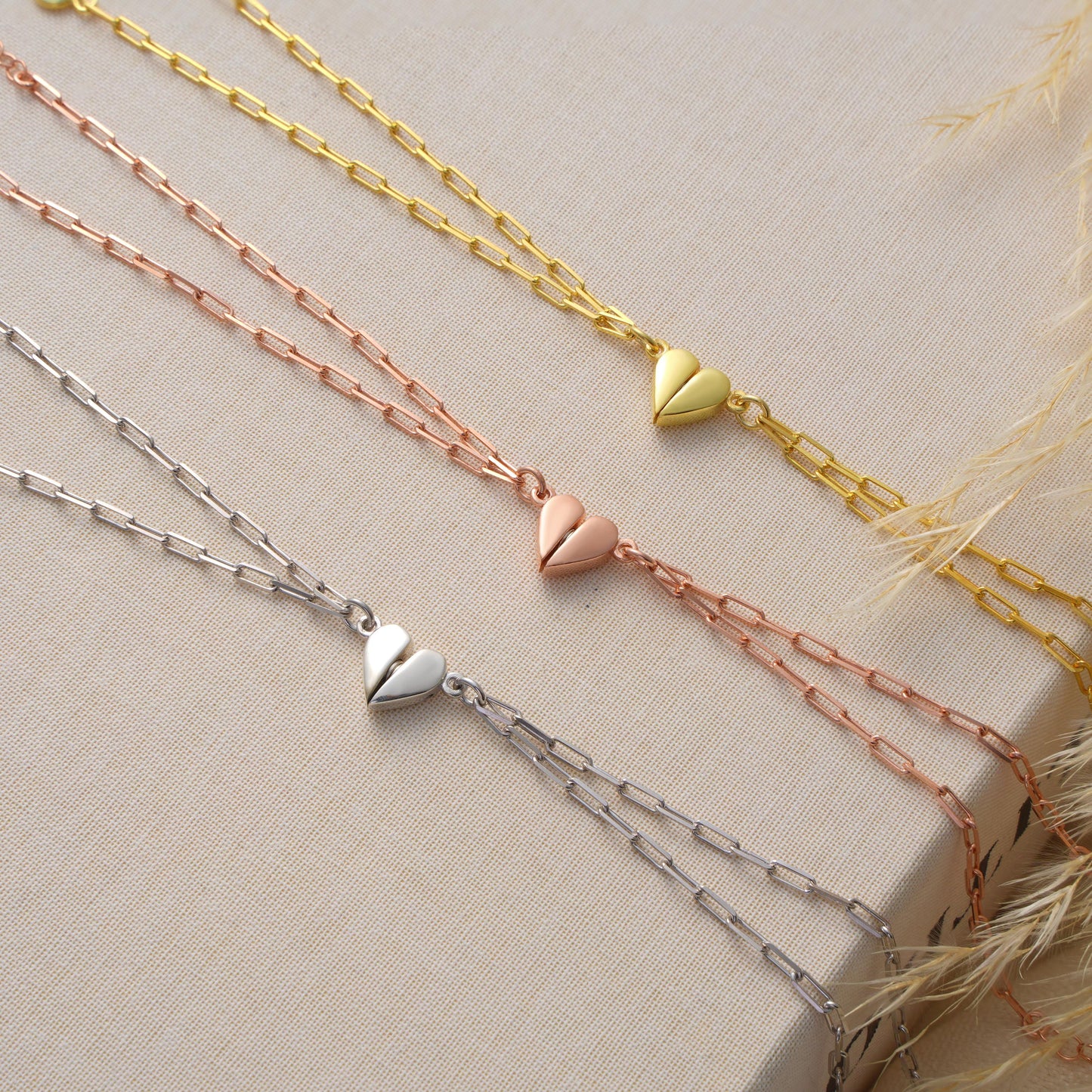 Material 925 Sterling Silver  14K Solid Gold  Rose Gold Silver
Finish High polish
Design Magnetic heart that forms a whole when placed together
Chain Paperclip-style chain
Adjustable 5&quot; 9&quot;
Closure Lobster clasp
Hypoallergenic nickel free
Handmade 
Couple Bracelets  Long-Distance Lovers Best Friends  Anniversary Gifts  Valentine Day
2 individual bracelets 1 set
gift packaging
Ready for gifting with optional note card
Processing time 2 3 business days
USA 2 5 business day
Europe 1 3 business day