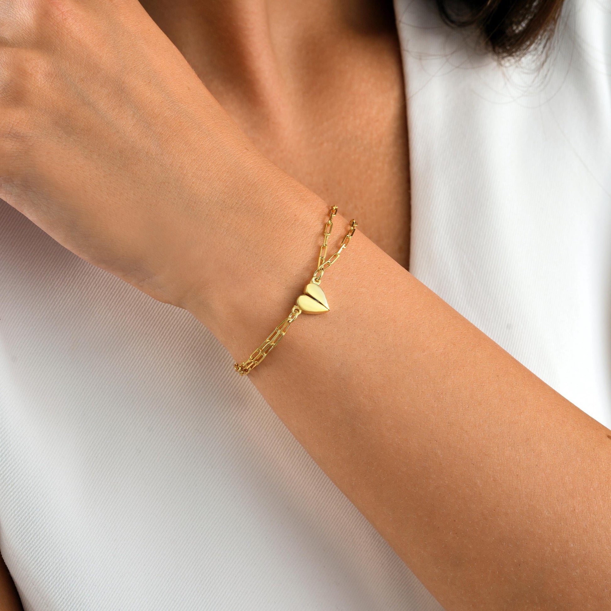 Material 925 Sterling Silver  14K Solid Gold  Rose Gold Silver
Finish High polish
Design Magnetic heart that forms a whole when placed together
Chain Paperclip-style chain
Adjustable 5&quot; 9&quot;
Closure Lobster clasp
Hypoallergenic nickel free
Handmade 
Couple Bracelets  Long-Distance Lovers Best Friends  Anniversary Gifts  Valentine Day
2 individual bracelets 1 set
gift packaging
Ready for gifting with optional note card
Processing time 2 3 business days
USA 2 5 business day
Europe 1 3 business day