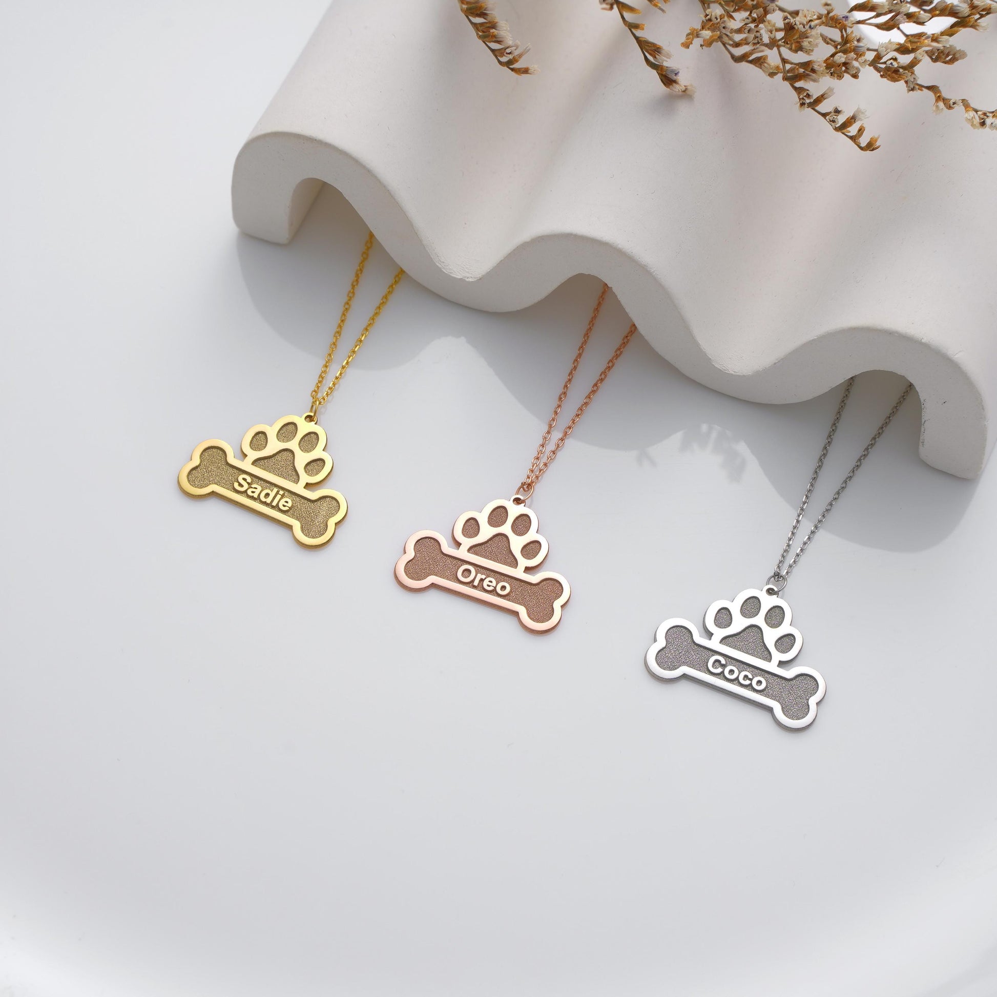 ✨ Custom Paw Name Necklace – Personalized Dog Bone Pendant ✨

A unique and heartfelt necklace featuring a paw print over a bone-shaped pendant engraved with your pet&#39;s name. Perfect for pet lovers, memorial keepsakes, or gifts for dog owners.

💛 Product Details
• Material: 925K Sterling Silver / 14K Solid Gold
• Closure: Spring Ring
• Pendant Size: Approx. 25mm
• Hypoallergenic & safe for sensitive skin