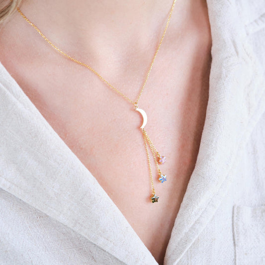 Shine like the night sky with our moon and star necklaces, featuring customizable gemstones at the ends. Choose the stones that reflect your story, creating a piece that’s as unique as the stars themselves