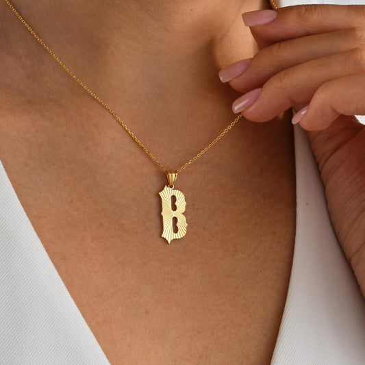 ✨ Fluted Initial Pendant – Bold Letter, Timeless Texture ✨  
Make your mark in style with this bold fluted initial necklace. Featuring a vintage-inspired ridged design, this pendant is crafted in 925K Sterling Silver 14K Solid Gold and offers the perfect balance of statement and elegance. Customize it with your letter of choice for a meaningful everyday piece
🎯 Perfect For  
Bold minimalists – Everyday statement wear – Birthday gifts – Monogram lovers – Vintage-inspired style – Gift for her