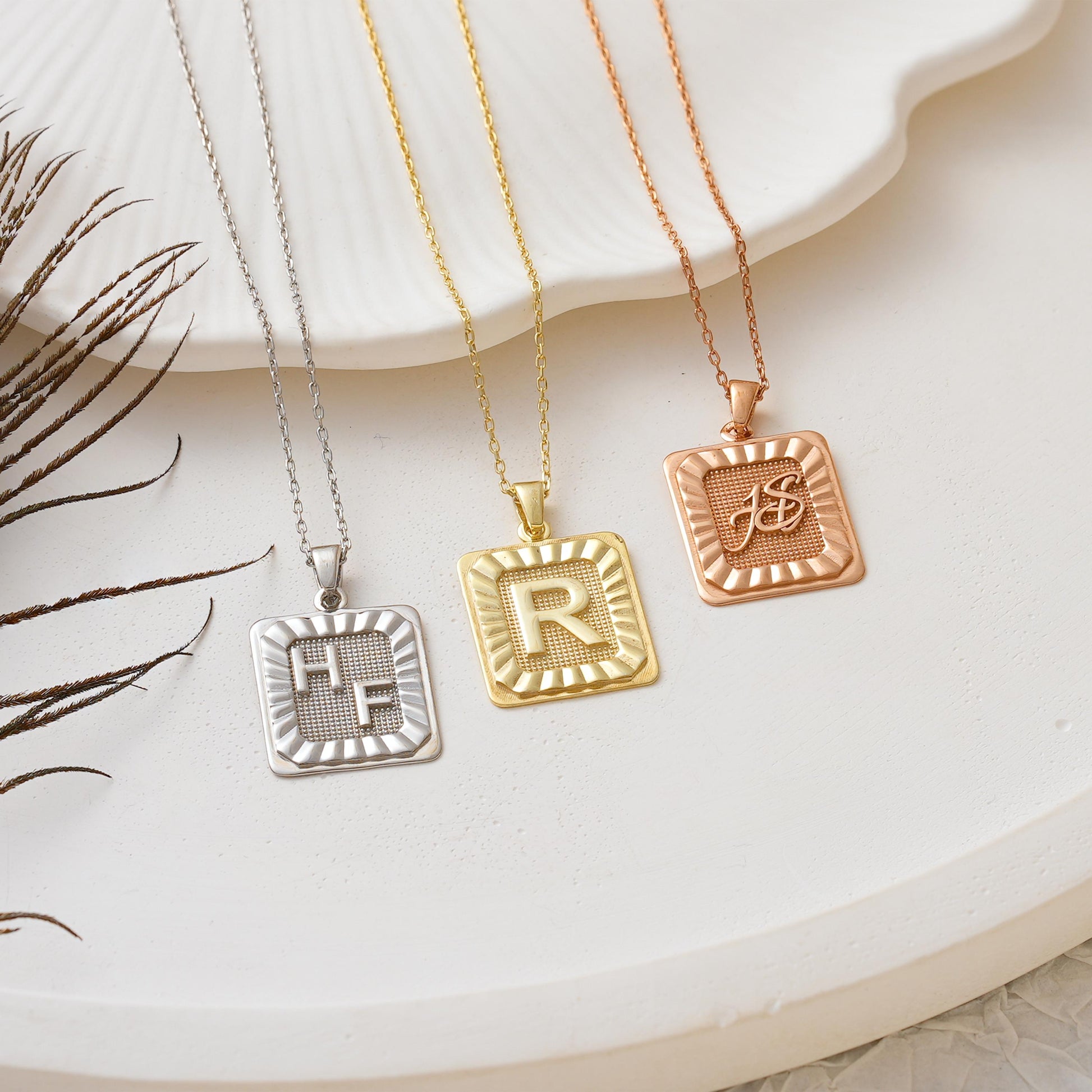 ✨ Initial Plate Pendant – Bold Identity, Timeless Design ✨  

This rectangle initial pendant features a bold raised letter framed by sunray detailing, giving it a striking and vintage-inspired look. Made from 925K Sterling Silver / 14K Solid Gold, it’s the perfect gift for someone special—or yourself.
• Pendant: Rectangular plate with raised letter and sunburst pattern  


🎯 Perfect For:  
Monogram lovers – Statement jewelry fans – Birthday gift – Personalized everyday wear – Gift for her